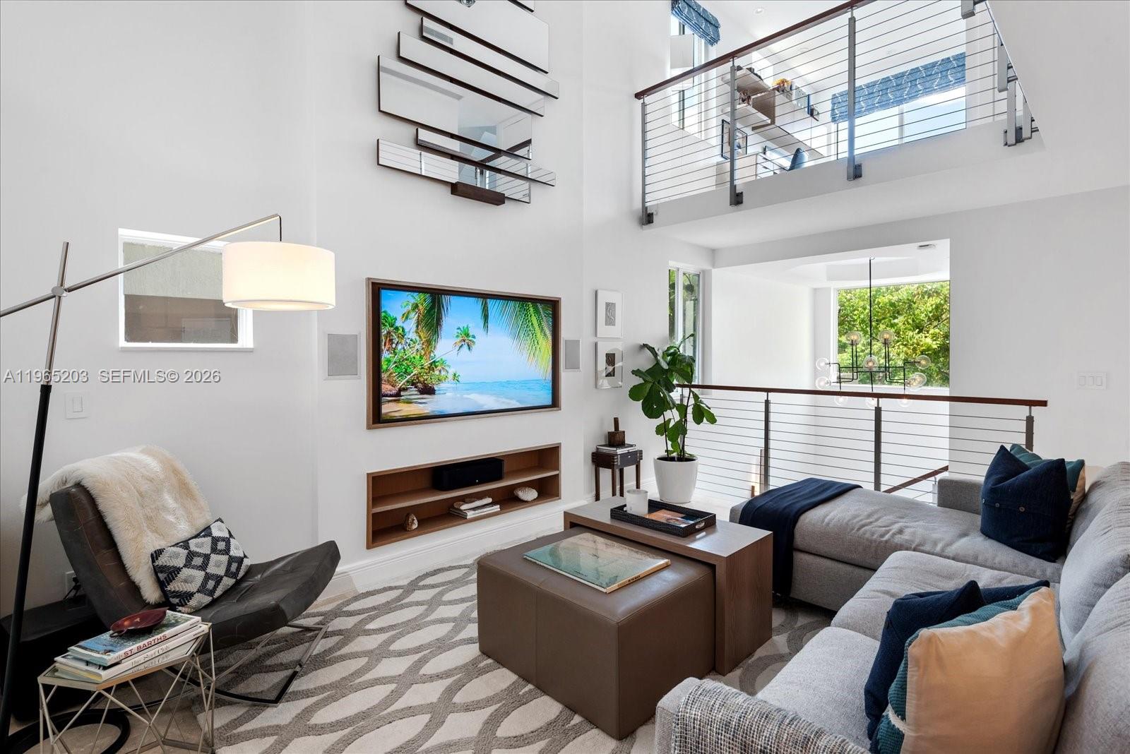 Luxury townhome in the heart of South of Fifth, Miami Beach’s most coveted neighborhood. This 3 bed plus den, 3 bath residence offers 2,120 square feet of exquisitely remodeled living space, delivering the feel of a private home with the convenience & security of a boutique condo lifestyle. Every detail has been thoughtfully upgraded, including a brand-new chef’s kitchen with modern cabinetry and high-end finishes, reimagined bathrooms with sleek contemporary design, & all-new hurricane impact windows that provide both peace of mind & energy efficiency. With its own private entrance, this townhome lives more like a house than a condo, creating a true sense of privacy & exclusivity from the moment you arrive. The open-concept main level is perfect for entertaining, with seamless flow between the living, dining, & kitchen areas, while the den offers flexible use as a home office, media room, or guest space. Upstairs, generously sized bedrooms & beautifully finished bathrooms create a comfortable retreat after enjoying the excitement of Miami Beach. One of the standout features of this residence is the expansive private roof deck, enjoying sunrise coffee or sunset cocktails, & soaking in the ocean breezes under the Miami sky. Two dedicated parking spaces add everyday convenience—a true luxury in the SOFI area. Step outside & you are moments from world-class dining, iconic beaches, beautiful parks, & the vibrant energy that makes South of Fifth the premier enclave of Miami Beach.