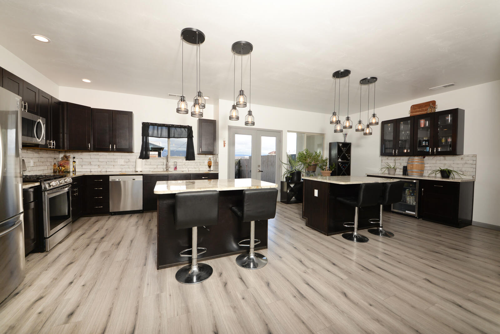 Beautiful 2 story Solar Home, move in ready! Spacious 3 bedrooms 2.5 Bath, Luxurious Townhome, large 2 car garage with stunning views. This modern custom-built home will knock your socks off, spacious kitchen w/2 islands, bar area, granite countertops, Samsung stainless steel appliances, French doors into the covered patio will be great for those summer BBQs. Large primary suite with French doors leading out to the balcony for those beautiful views. 6-foot tub, walk in shower with custom tile, granite counters with double sinks and custom lighting. Outdoors, enjoy a beautiful Japanese garden surrounded with bamboo accent and a gorgeous fishpond which make this a great place to host your guests all year round.  NO HOA!