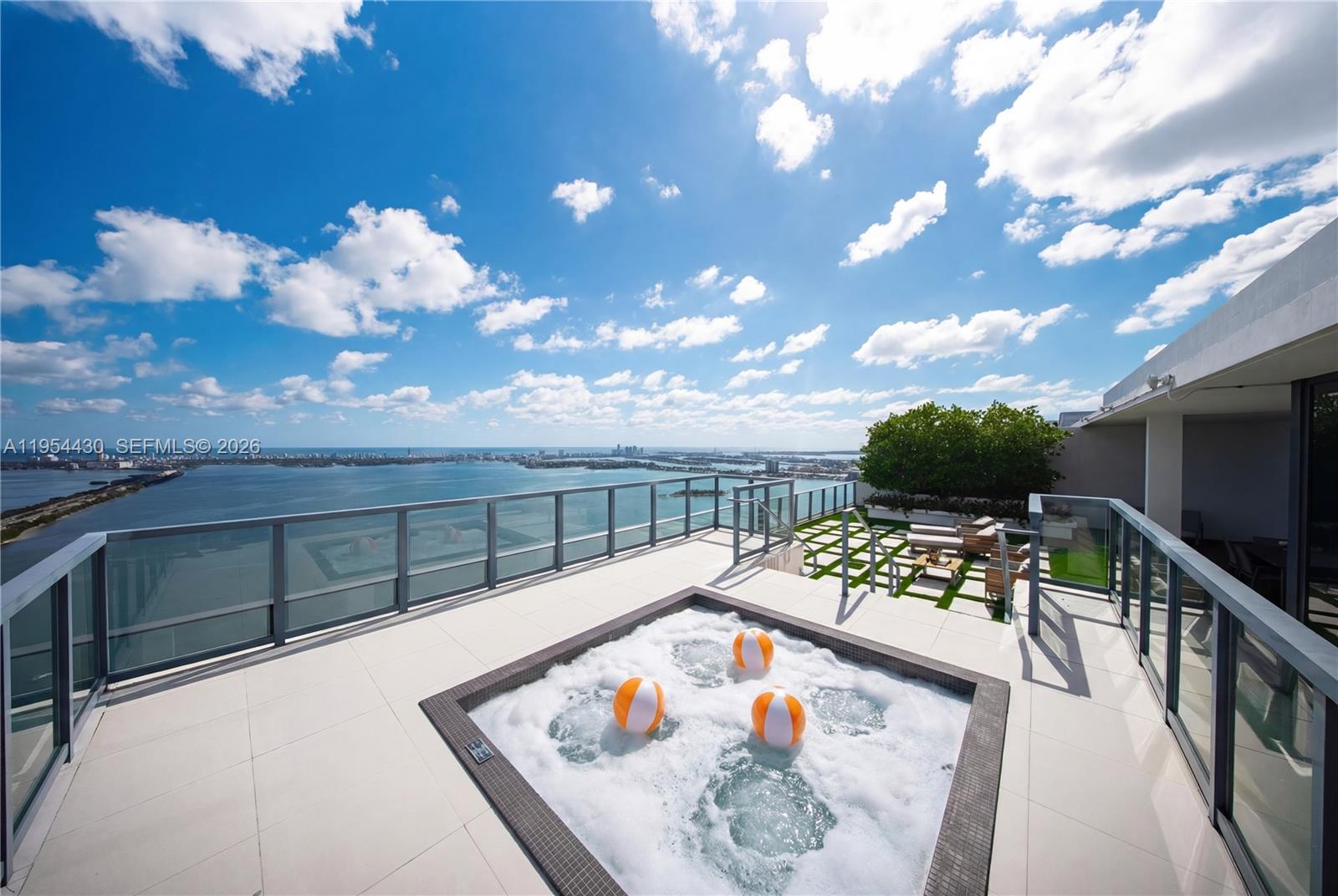Panoramic Views at One Paraiso! A rare opportunity to own this almost new, hardly lived in, waterfront 2-story Upper Penthouse, where breathtaking ocean, bay, city & skyline sunset views unfold from every room. Spanning over 3,137 Sq.Ft., this 4BD/5.5BA N.E. corner two-story residence is wrapped in floor-to-ceiling glass, filling the interiors with natural light. A private elevator foyer entry, an open eat-in kitchen with an island, multiple balconies, & a gorgeous primary suite with walk-in closets, primary bath with dual sinks, & separate tub & shower. High ceilings everywhere, complete electric shades throughout, a storage room, and 2 parking spots. Entertain in Style! What sets this home apart is the expansive private covered rooftop terrace with a summer kitchen, jacuzzi, and an incredibly rare offering in Miami. This pet-friendly building is known for its resort-style lifestyle & full-service experience. Residents enjoy world-class amenities including multiple waterfront pools, tennis courts, a State-of-the-Art fitness center, spa & sauna, movie theater, Amara restaurant, business center, valet, concierge, & 24-hour security, all within one of Edgewater’s most prestigious towers. Perfectly positioned in Edgewater, you’re surrounded by the Design District, Midtown, Wynwood, & Downtown Miami, top dining, shopping, & cultural destinations just mins away. Enjoy waterfront park & dog park, baywalk paths, & easy access to Miami Beach & MIA Airport.