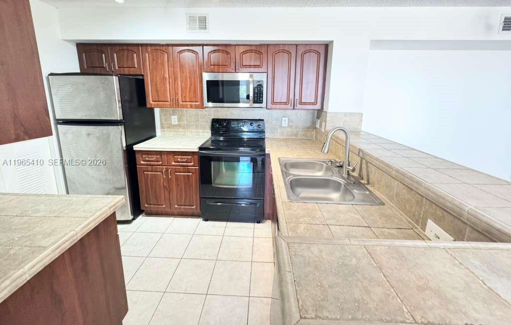 Open-concept living area at 1715 Village Blvd - Condo in West Palm Beach