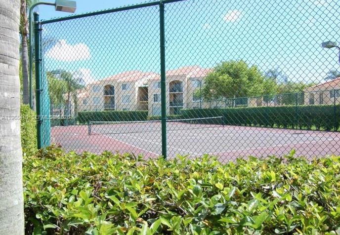 Well-appointed guest bedroom at 1715 Village Blvd - Condo in West Palm Beach