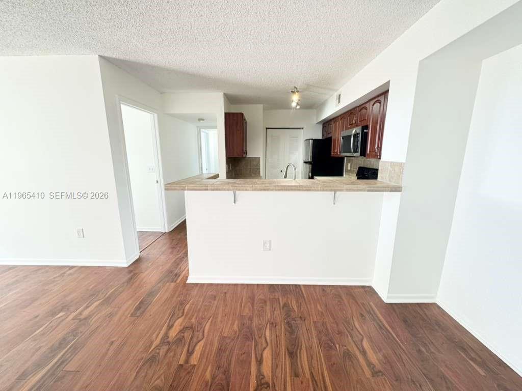 Modern kitchen with designer features at 1715 Village Blvd - Condo in West Palm Beach