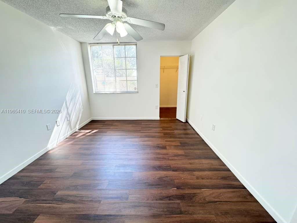 Well-appointed guest bedroom at 1715 Village Blvd - Condo in West Palm Beach