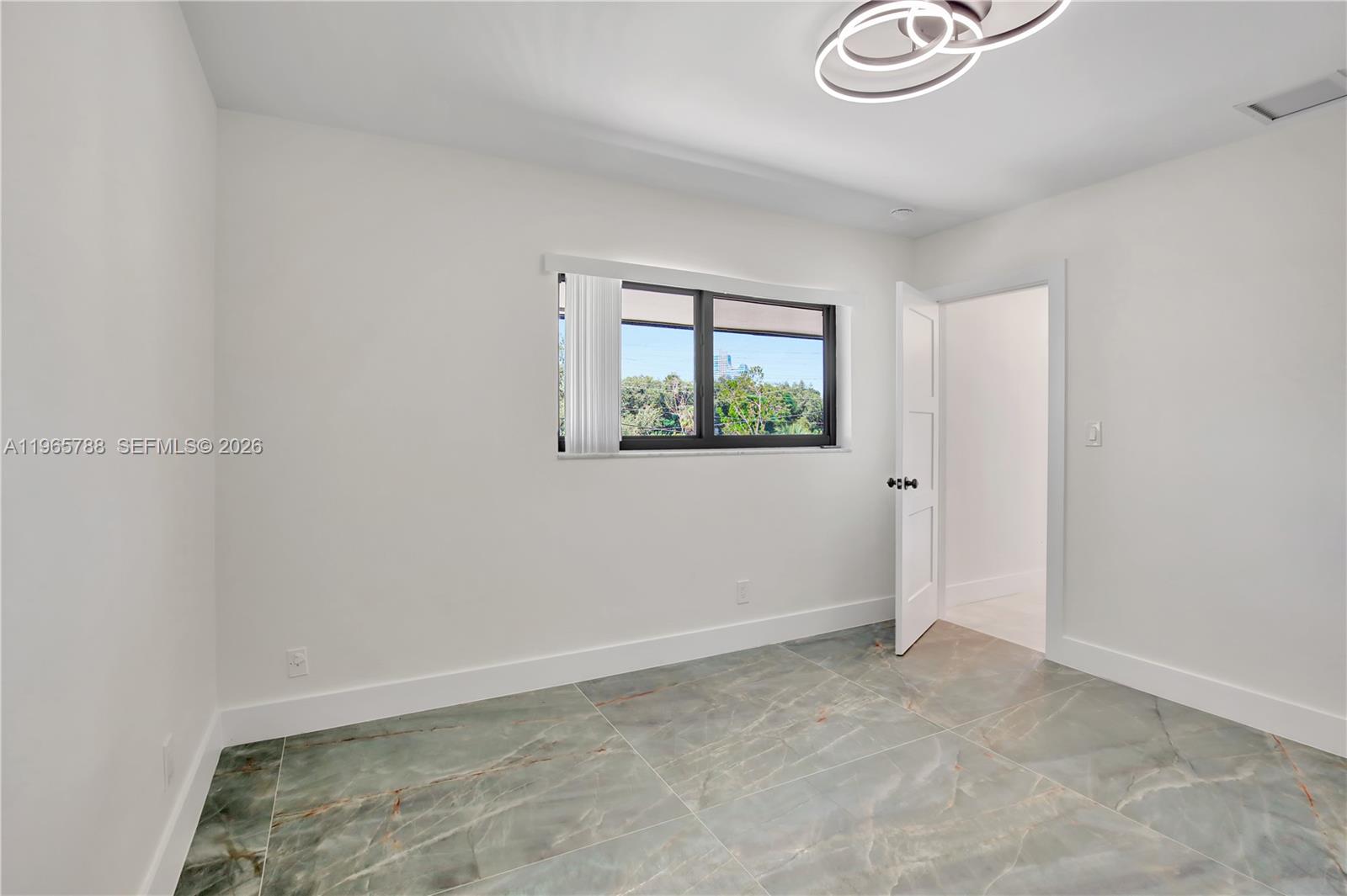 Well-appointed guest bedroom at 5980 40th Ave - Luxury Estate in Dania Beach