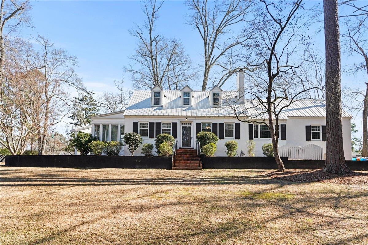 Welcome to timeless charm in the heart of Cheraw SC! Built in 1945 and thoughtfully updated, this beautifully maintained home offers approx. 2379 sq ft of character, space and modern comfort - all situated on a generous .76 acre lot.  Step inside to find three spacious bedrooms and 3.5 baths, providing room for family, guests, or multi-generational living.  Recent updates blend seamlessly with the home's historic details preserving the architectural charm and craftsmanship you love about classic homes while offering the conveniences today's buyers expect.  The kitchen features stainless steel appliances and countertops, creating a clean, functional space perfect for everyday living or entertaining.  Multiple living areas provide flexibility for gathering, relaxing or working from home.  Additional highlights include:  Basement for storage or expansion potential, two car garage with a convenient half bath, expansive yard with mature setting, updates completed while honoring the homes original character.  If you appreciate solid construction, thoughtful updates and the warmth of a home with history 607 3rd St delivers!