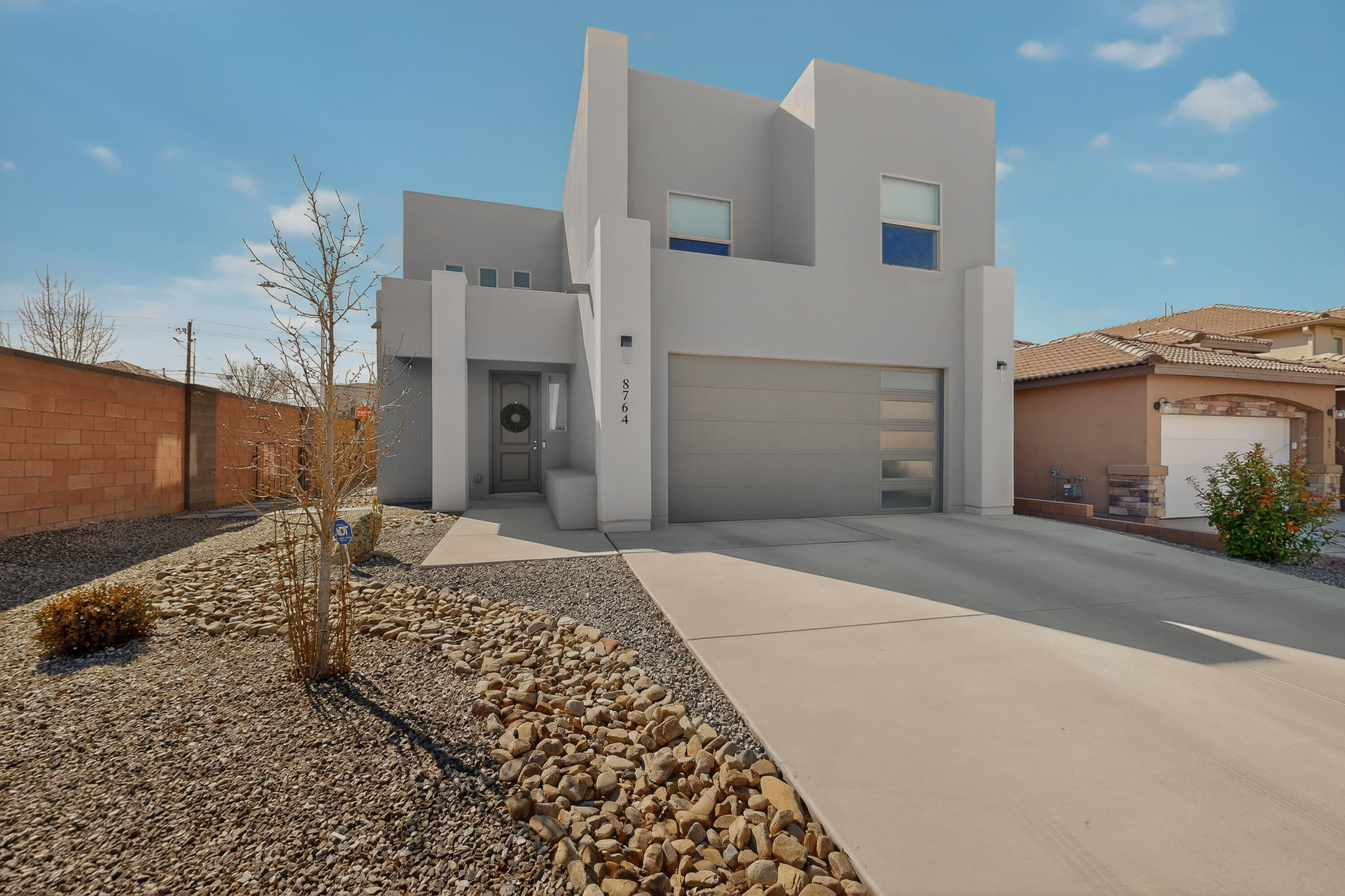 This newer construction modern 4-bedroom 3.5 bath home built in 2024 has a space for everyone. The home was thoughtfully designed with two master suites, offering a potential in-law suite.  The open-concept kitchen flows directly into a spacious family room, boasting tall ceiling with plenty of natural night.  The home has 2 HVAC systems offering dual zone control. The home offers the security of a gated community, all while located in a top-rated school district.