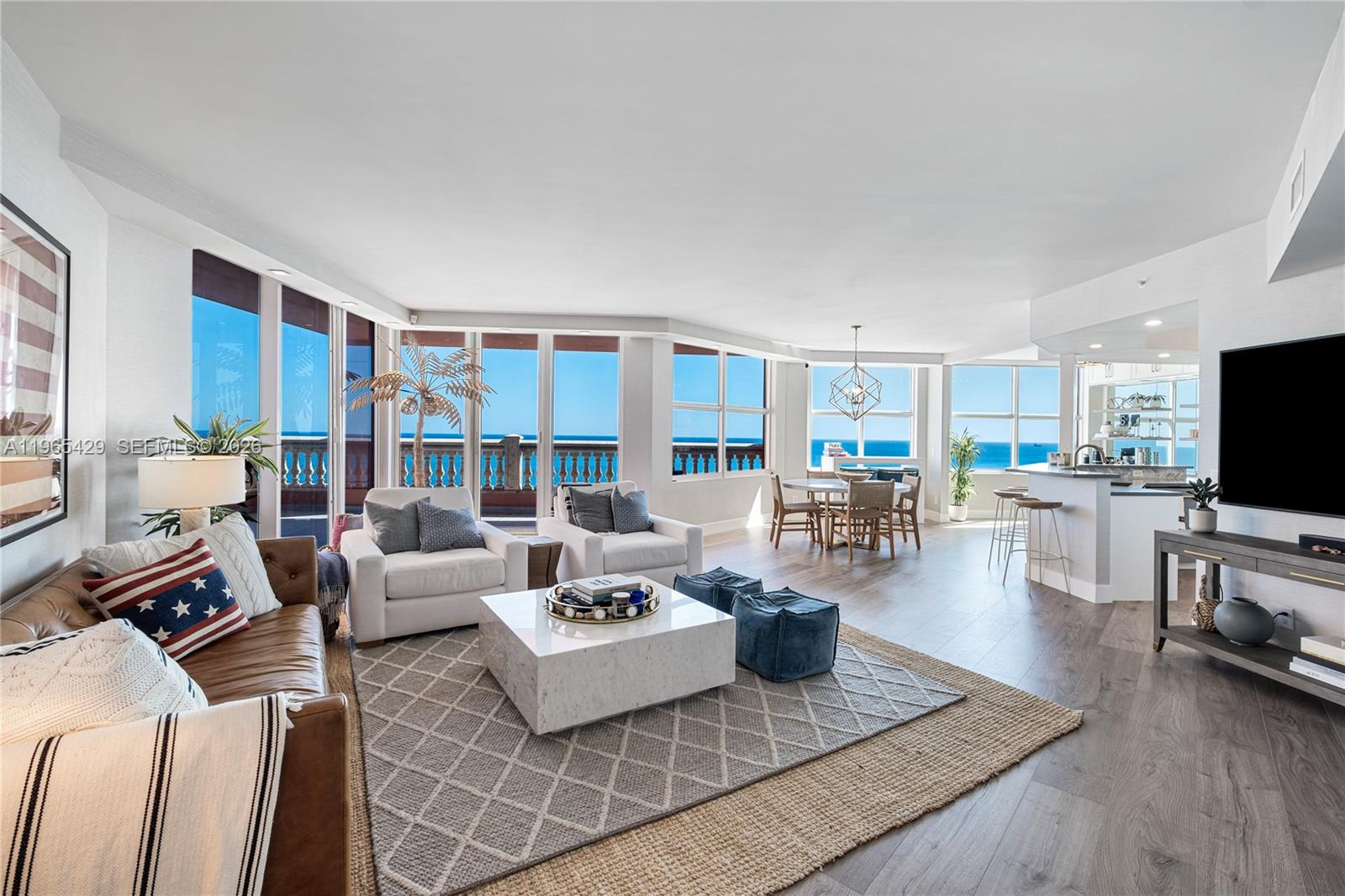 Come see this beautifully customized 3-bedroom, 2.5-bathroom at The Palms offering elevated coastal luxury with sweeping views of the Atlantic Ocean, Intracoastal Waterway, and city skyline. This spacious residence features floor-to-ceiling glass that fills the home with naturallight, an open kitchen flowing into a  great room ideal for entertaining, and two expansive terraces showcasing breathtaking sunrises over the ocean and vibrant sunsets over the Intracoastal. The large primary suite is a private retreat with a spa-inspired bath and walk-in closet.Residents enjoy resort-style amenities including a heated pool, full beach chair and towel service, fitness center, tennis, squash and racquetball courts, Club Room, two assigned parking spaces, and 24-hour valet within a gated community that ensures privacy and security—truly living at the intersection of sea and sky.