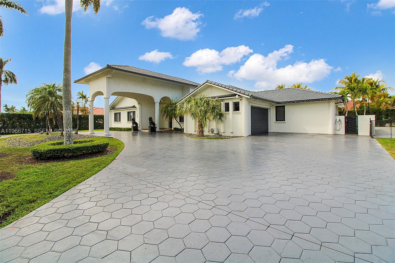 Completely remodeled just 1.5 years ago, this stunning 5BR/5BA residence offers modern elegance and exceptional functionality. The sleek, updated kitchen and beautifully renovated bathrooms showcase high-end finishes throughout. Impact-resistant windows and new entry gates provide added security and peace of mind. Designed for entertaining, the backyard is a true showstopper featuring 5,000 sqft of marble flooring, a newly refinished pool with a slide and cascade, and a jacuzzi w/starlight ceiling, built-in pool bar. Inside, Spanish porcelain tile floors, expansive walk-in closets, and a split floor plan create comfort and versatility—perfect for an in-law suite or maid’s quarters. Situated on a large corner lot with top-tier security systems and multiple terraces for seamless indoor-outdoor living, this home blends luxury, privacy, and style. Natural Gas in the process of being installed.