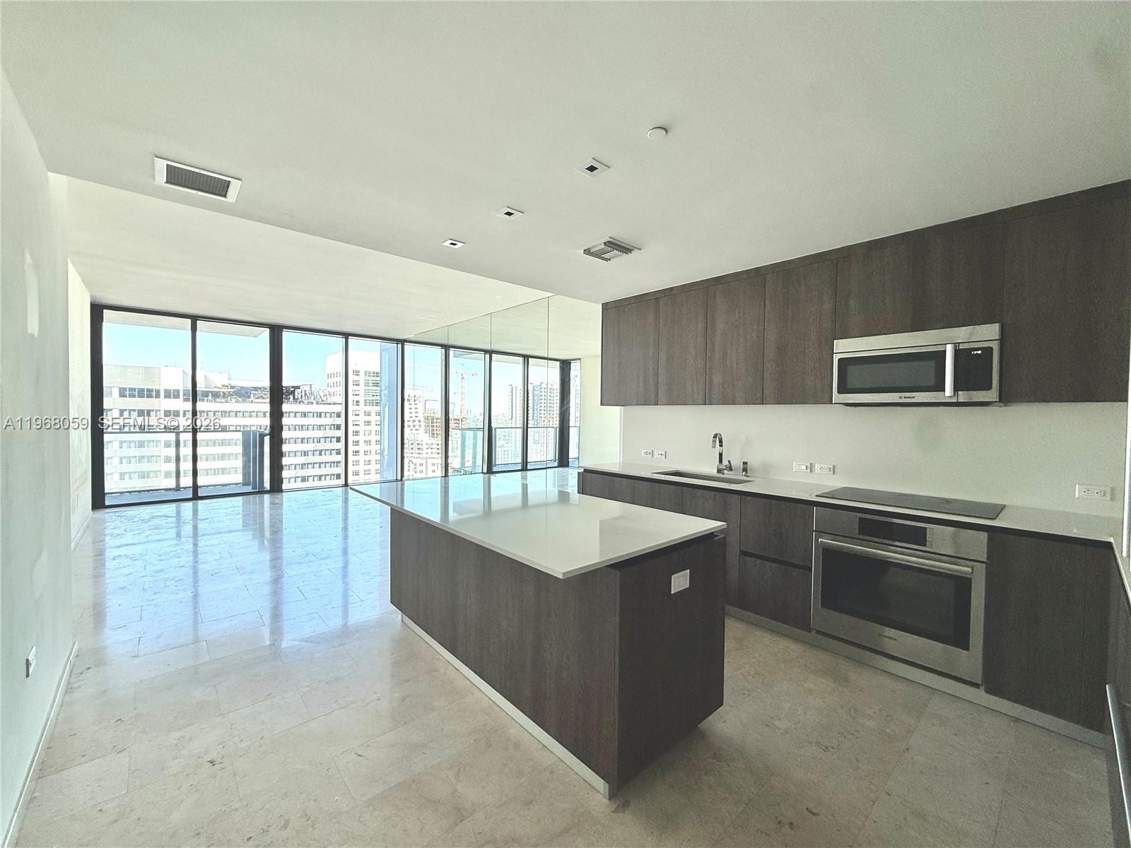 Step into urban sophistication at Rise, located in the heart of Miami’s dynamic Brickell neighborhood. This beautifully designed 1-bedroom, 1.5-bath residence offers an elevated lifestyle with sweeping city views and a generous terrace perfect for enjoying the skyline. The spacious primary suite includes a walk-in closet and a luxurious bath retreat featuring a soaking tub and sleek glass shower. The modern kitchen, crafted with Italian design elements, features high-end appliances and elegant stone countertops—ideal for both everyday living and entertaining. All set within an architecturally striking tower by Arquitectonica.