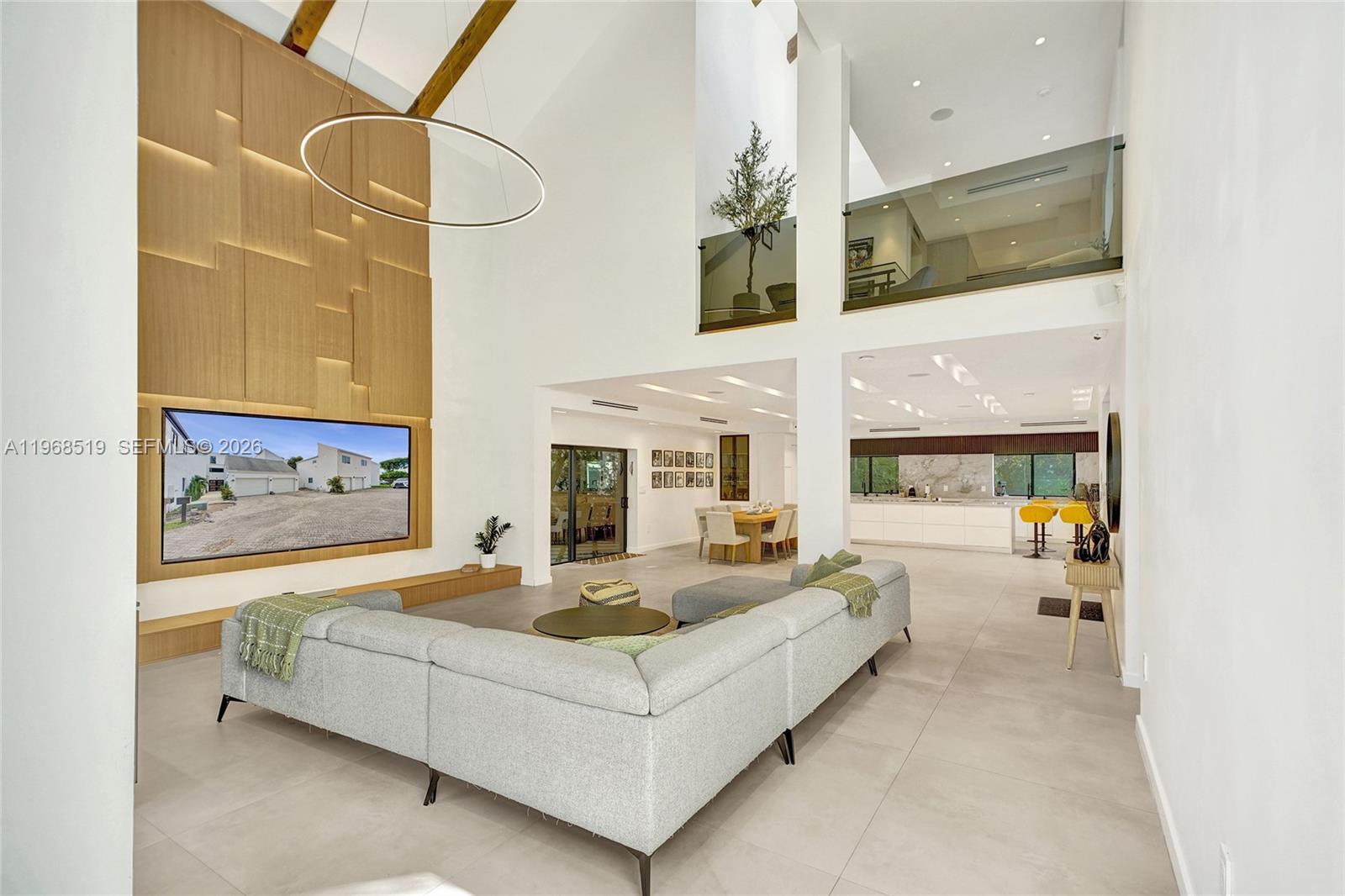 Completely rebuilt , this stunning 6-bedroom, 6.5-bathroom residence offers 4,886 square feet of luxurious living space with every detail thoughtfully upgraded. Everything in the home is 100% new, including the roof (flat and shingle, 2023), insulation, and three A/C units (5, 5, and 3 tons) installed in December 2023.Designed with modern elegance in mind, the home features impact windows and doors, smart toilets, a fully integrated security system on both floors, security cameras, built-in Bose ceiling speakers throughout (including outdoor areas), and a wall-mounted iPad for smart home control. Kids’ bedrooms include Bluetooth-enabled ceiling fans for music.The gourmet kitchen showcases quartz countertops, LED-upgraded cabinetry with touch features, and a ductless hood. The open-concept primary suite seamlessly connects to a spa-style bathroom with smokey grey glass shower for added privacy.Upstairs, you’ll find stackable LG laundry units for convenience. Outdoors, enjoy a 20x20 pergola (2025), a fully equipped outdoor kitchen with BBQ grill, sink, ice machine, and refrigerator, plus new wood fencing and irrigation system. Landscaping is maintained by the community, which also offers a community pool.Additional highlights include a 2-car garage, driveway parking for two more vehicles, and ample guest parking.