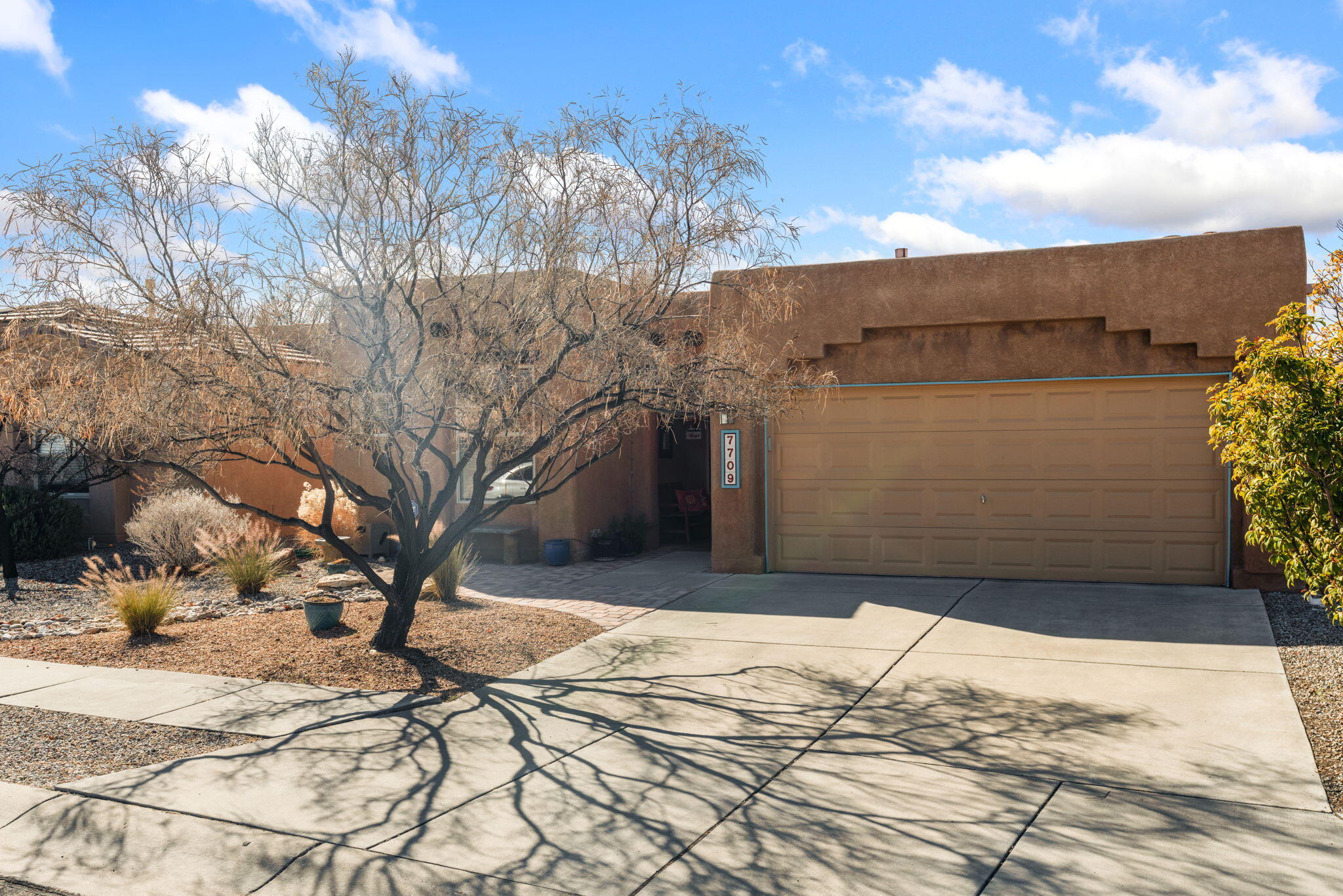 Welcome to this beautifully maintained single-story home in the sought after Vista Del Norte neighborhood offering 4 spacious bedrooms and an ideal floor plan with wonderful bedroom separation for added privacy and comfort. Luxury vinyl flooring flows throughout the main living areas and berooms, combining durability with a modern, upscale feel. The heart of the home is the gorgeous kitchen, featuring rich granite countertops, abundant cabinetry, and upgraded stainless steel appliances -- including the refrigerator. It's a space designed for both everyday living and effortless entertaining.The inviting great room is anchored by a cozy gas fireplace, creating a warm and welcoming atmosphere for relaxing evenings at home. Natural light pours in through the Pella sliding door, which opens