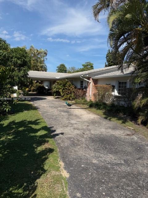 Amazing location for this 4/3/2.0 private house in South Gables on more than 3/4 of an acre! Is located across the street form Westminister Christian High School. House is easy to show! Owner is in process of doing some work on house at moment but a new owner most likely will want to remodel much of it. Could be an opportunity for a builder due to it's huge lot size and fantastic location.House cannot be shown until March 12, 2006.
