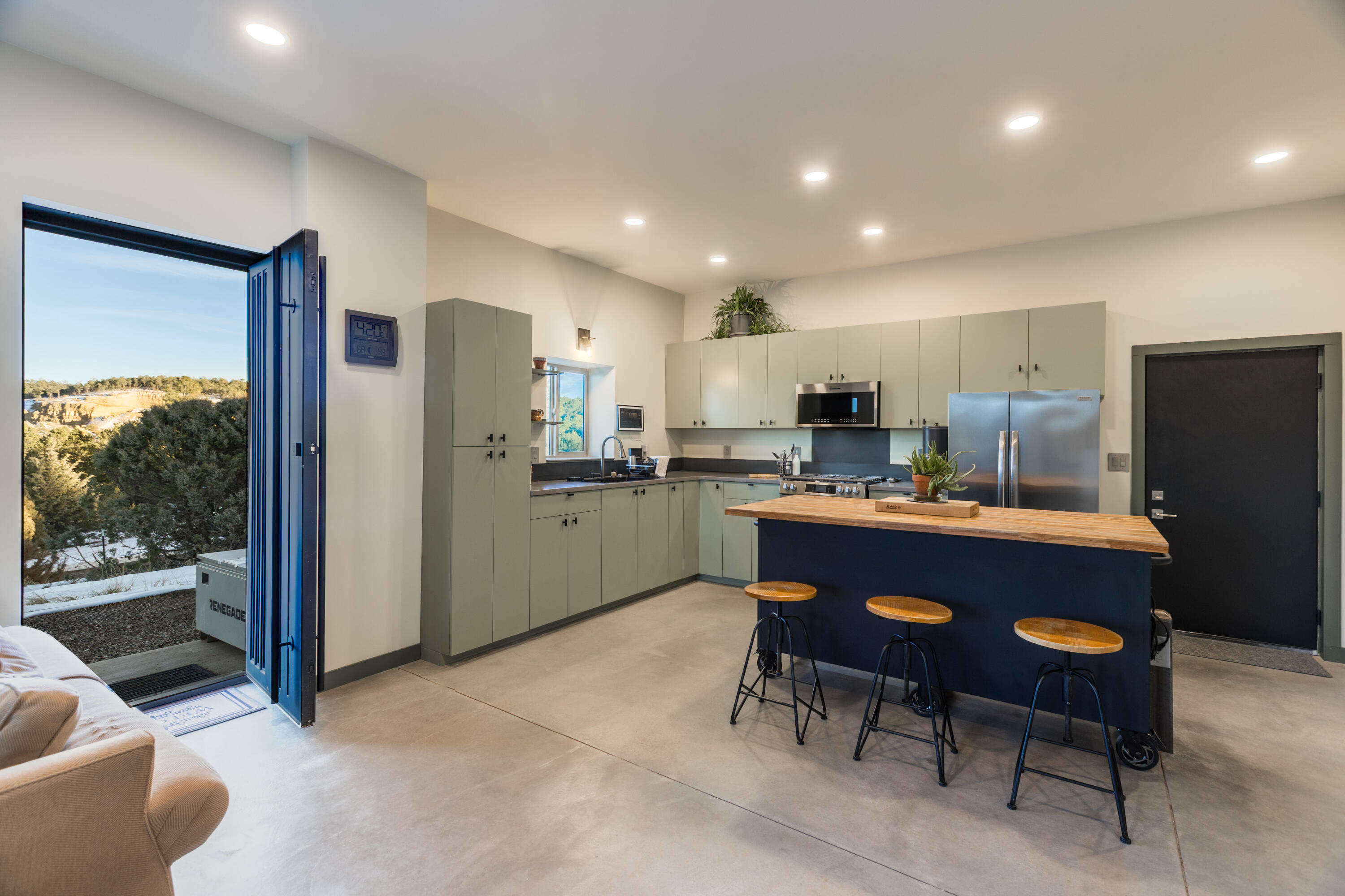 OPEN SUN 1-3 PM. Escape to the mountains & enjoy this gorgeous, fully custom ''shopdominium'' just completed in May of 2025. Boasting 2 beds, 2 full baths, 1437 sq ft, with fully foam insulated 38 x 47.5 attached shop, all on roughly 1 acre. RV plug-in & door, additional 2-car door, plus room for all your toys, hobbies & workshop space, this property is everything you've always wanted-shop and home all in one. Enjoy beautiful mountain views out the custom iron doors, while catching the bursting stars off the back covered patio. Outfitted with a 2500 gal cistern system, on-demand water heater & 3 mini-splits heat/cool, plus custom pellet stove, this home is built for efficiency & ease. Quick 25 mins to ABQ yet tucked away in the privacy of the trees. This property is unique & gorgeous.