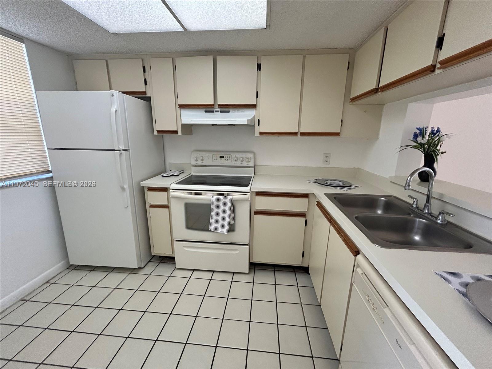 Modern kitchen with designer features at 5200 31st Ave - Condo in Fort Lauderdale