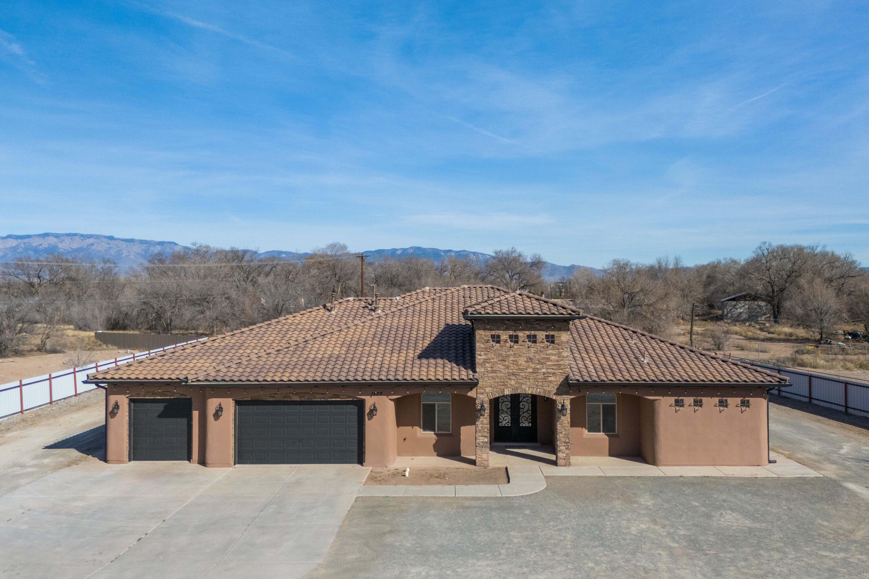 Sophisticated residence on a gated 1.33ac lot outside city limits, offering 3,179 sq ft of thoughtfully designed living. 4 bed, 3.5 bath -- en suite baths in every bedroom. Office, formal dining, and butler's pantry create versatile spaces for work and entertaining. The kitchen presents Level 5 granite countertops, custom cabinetry throughout, GE Cafe Series appliances, and thoughtfully placed pot filler. Owner's suite features a garden tub, walk-in shower with multiple shower heads, and custom lighting at both vanities. Convenient central vac, and oversized 3 car garage w/ample storage and workspace. Expansive lot possibilities: pool/spa, detached garage or workshop, recreation, or agricultural use (buyer to verify). See listing details in the documents for full specifications.