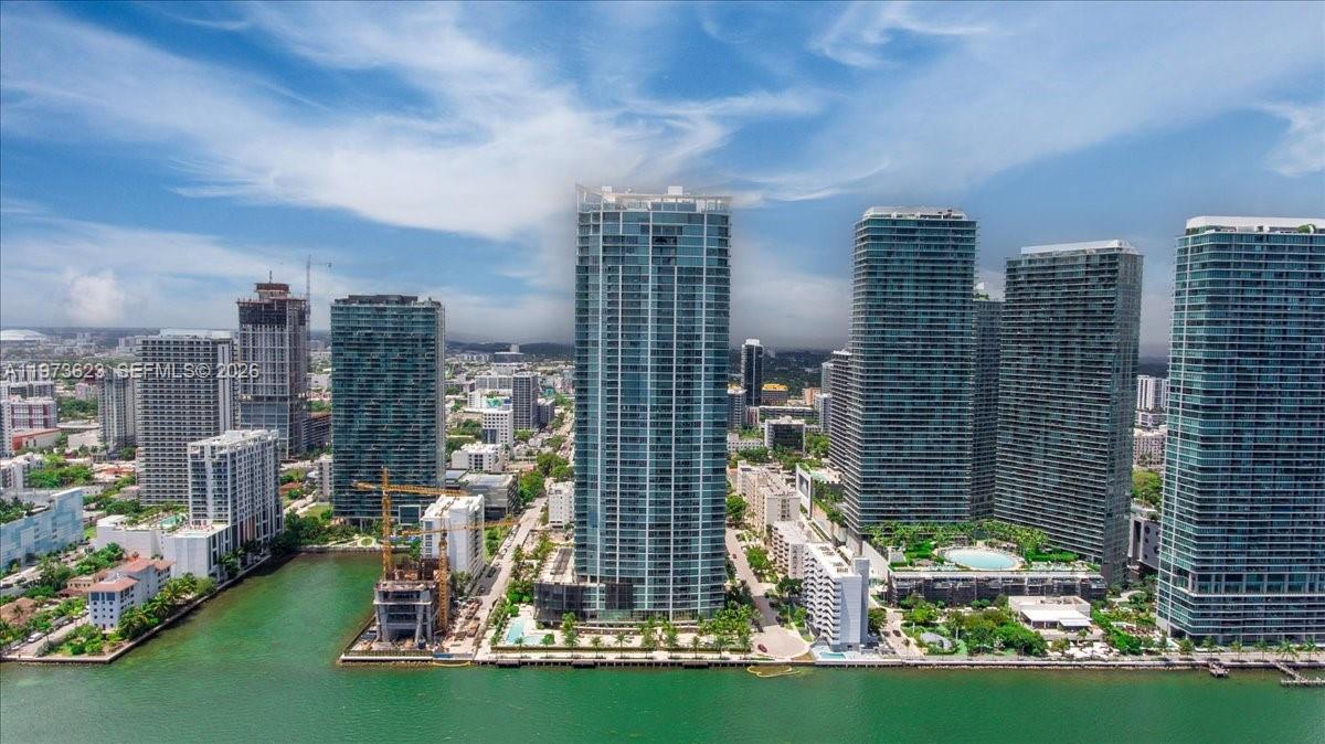 Experience ultimate luxury in this exclusive residence featuring the most breathtaking panoramic views of the ocean, Biscayne Bay, and the iconic Miami skyline. This elegant 2 -bedroom, 2 - 1/2 bathroom home showcases the coveted 04 tower line – the finest in the building – offering an unparalleled lifestyle of sophistication and comfort. A true masterpiece in the sky. Includes 1 assigned parking space and a climate-controlled storage room. A rare opportunity for the most discerning buyers.