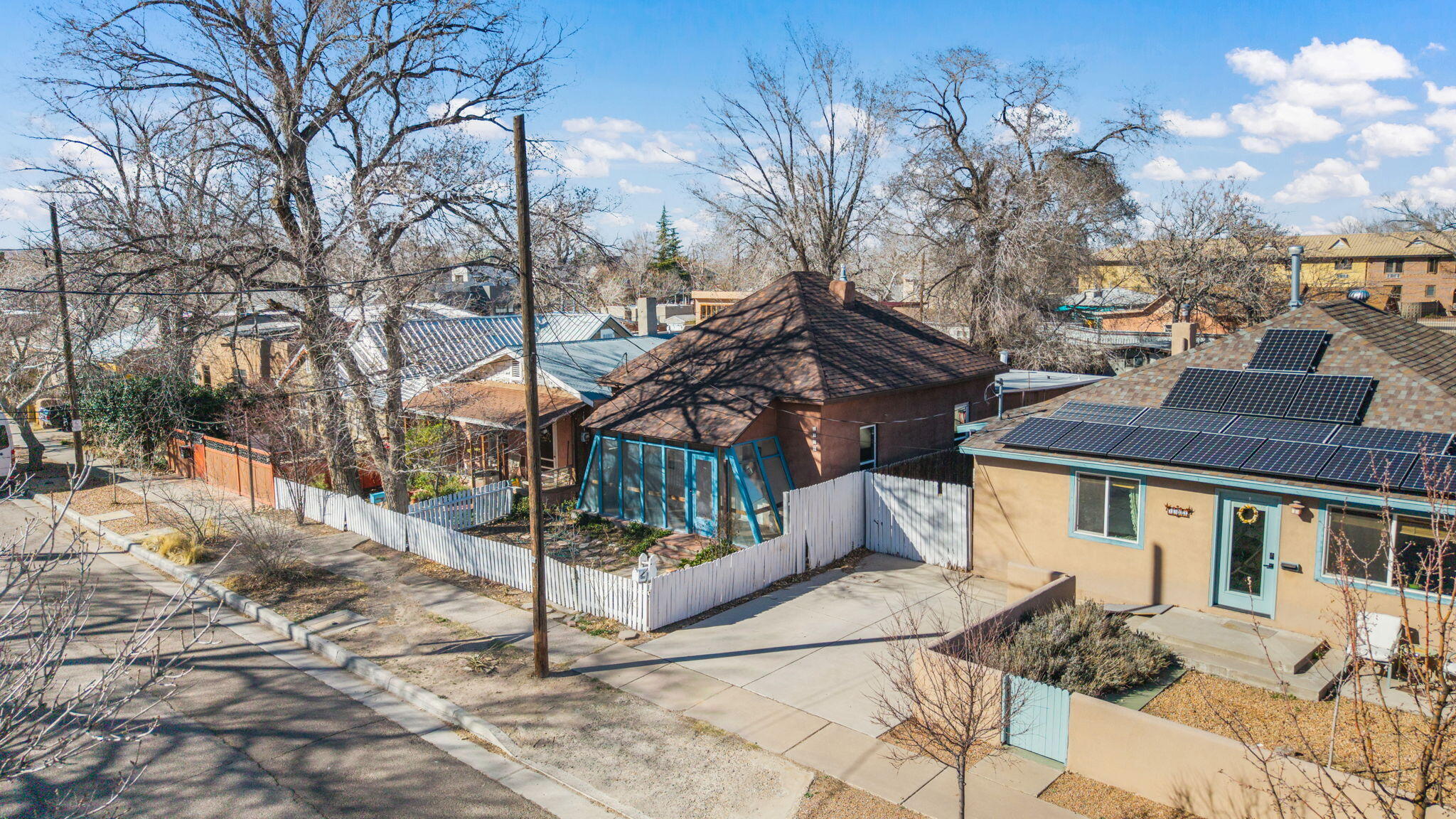 Just moments from Old Town and downtown, this delightful 3-bedroom, 2-bath home offers both charm and convenience. A classic white picket fence and welcoming front porch create inviting curb appeal, while inside you'll find a comfortable, functional layout highlighted by pass-through windows and a mix of tile and new carpet. Recent improvements, including a new roof and new windows, provide added value and peace of mind. The kitchen includes appliances, and the washer and dryer convey for added ease. The primary suite features its own private bath, offering a quiet retreat. Don't miss this opportunity to own a character-filled home in a prime location. Schedule your showing today!