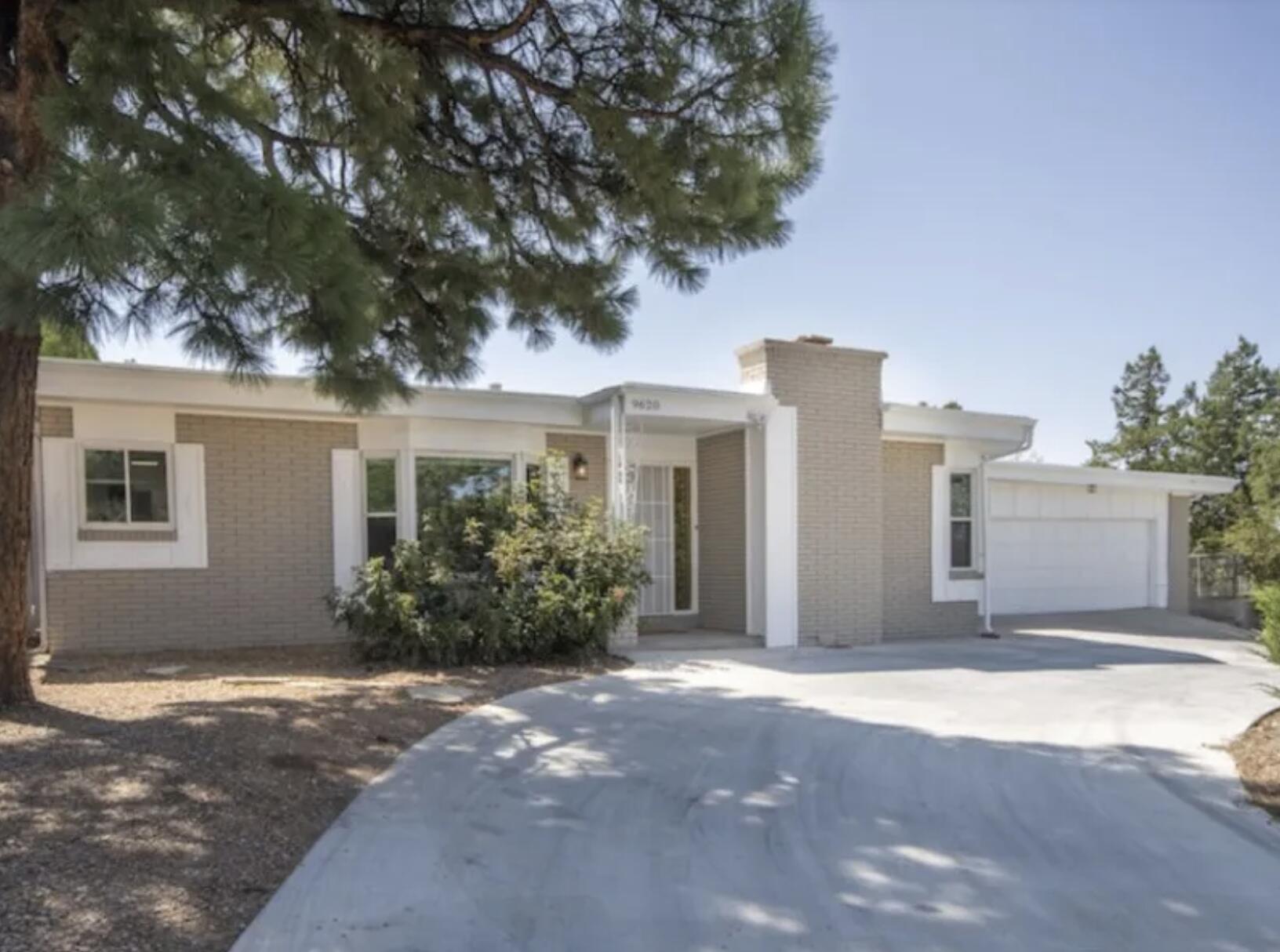 Fully remodeled and move-in ready, this light-filled home offers an open-concept floorplan designed for modern living. Newer TPO roof with skylights, fresh paint, updated interior doors, and designer lighting throughout. The redesigned dream kitchen showcases a large island, wet bar, wine fridge, pantry, quartz countertops, glass tile backsplash, gas range, microwave, and dishwasher. Waterproof laminate flooring, tile in baths and laundry. Spacious living area with custom-tiled fireplace. Luxe owner's suite with freestanding tub, dual sinks, walk-in closet, and patio access. Oversized 2-car garage, refrigerated air, fully fenced yard.