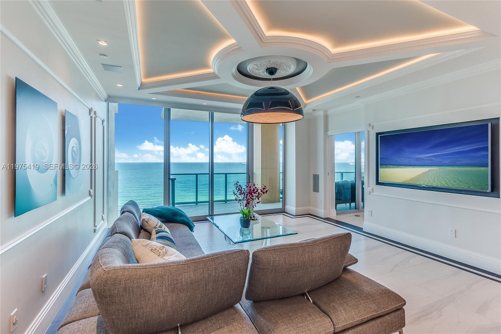 Direct ocean views welcome you the moment you step off your private elevator into this exceptional Lower Penthouse at Il Villaggio. Featuring 10’ ceilings and a coveted flow-through layout, this residence captures breathtaking, unobstructed views of the Atlantic Ocean to the east and vibrant city sunsets to the west. Expansive terraces create seamless indoor-outdoor living and an elevated oceanfront experience.The open chef’s kitchen, accented with elegant designer lighting, flows effortlessly into the living and dining areas, ideal for refined entertaining or everyday luxury. The residence is fully integrated with a Control4 smart home system, allowing centralized control of lighting, climate, audio, and more throughout the entire home.Bedrooms are thoughtfully arranged in a split floor plan for privacy, each with its own en-suite bath and private balcony. Each bathroom features a Toto Washlet® smart toilet with integrated bidet functionality, heated seat, warm water cleansing, and customizable comfort settings.Il Villaggio is a true gated, full-service luxury condominium with 24-hour security, concierge, and exceptional staff. The building has recently completed concrete restoration and fully remodeled amenities, now presented brand new. Residence includes a private electric charging station. Owner occupied. 24-hour notice required. Schedule your private showing today and experience the very best of South Beach oceanfront living.