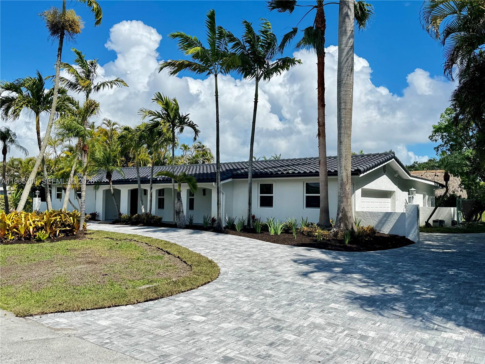 Fully remodeled and designed for modern living, this stunning Palmetto Bay home offers the perfect blend of style, comfort, and waterfront charm. Renovated from top to bottom, it features brand-new flooring throughout, impact windows and doors, and fresh interior and exterior paint.The bright, open-concept layout seamlessly connects the living, dining, and kitchen areas, creating an ideal space for everyday living and entertaining. The brand-new kitchen showcases sleek cabinetry, contemporary finishes, and a functional design, complemented by a dedicated bar area perfect for hosting.The spacious primary suite has been completely transformed, including a beautifully remodeled master bathroom. With 3 bedrooms and 4 full bathrooms, the home offers flexibility, privacy, and comfort for family and guests alike.Step outside to a fully renovated pool area designed for relaxation and entertaining. The oversized lot provides generous outdoor space, while the canal in the backyard adds peaceful water views and a true South Florida feel.This home is currently in its final stages of completion and will be ready for delivery in early April—an exceptional opportunity to own a turnkey waterfront property in one of Miami’s most desirable neighborhoods.