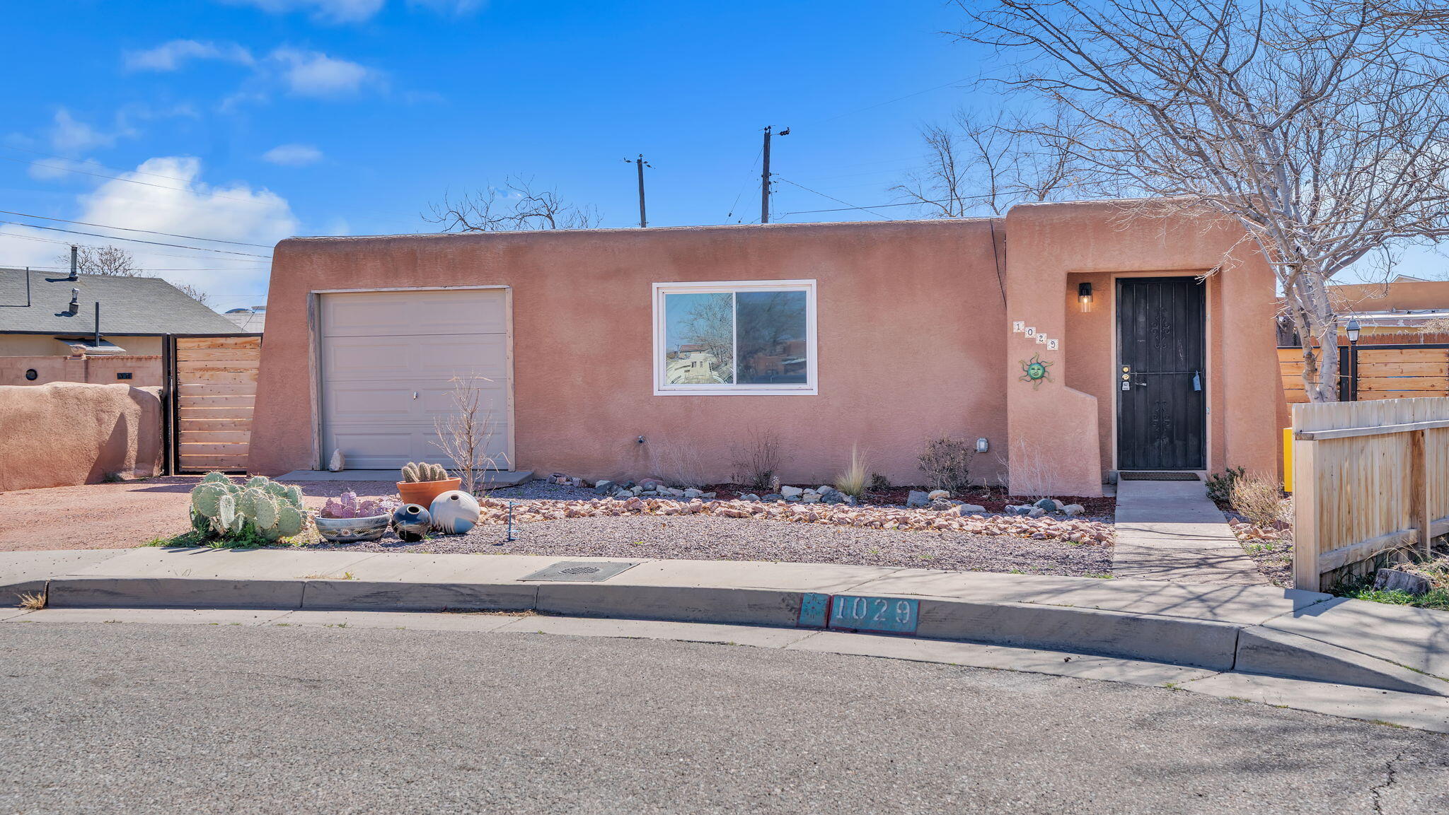 Tucked away at the end of a cul-de-sac in the heart of the 8th and Mountain district in Downtown Albuquerque is this dreamy home with tons of natural lighting and a huge back yard! Imagine beginning your day meandering to Slow Burn Coffee for your daily pick me up, wandering to Golden Crown Panaderia for an empanada, getting lunch across the street at Cocina Azul, and ending your day with Rumor Pizza - all without needing a car.Refrigerated air conditioning and forced air heating ensure you're comfortable year round, and the open living, dining, and kitchen area is perfect for entertaining or relaxing with loved ones around the wood burning fireplace.Old Town, the Sawmill District, and Downtown are all a stone's throw away, and connecting to the rest of Abq is easy with I-40 close