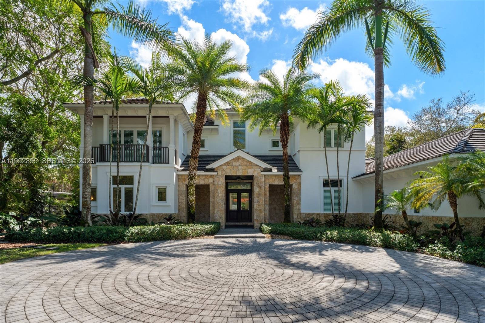 Set on a gated 31,798 SF lot in the heart of Pinecrest, this impressive 6BD/7.5BA residence offers refined living spaces designed for comfort and entertaining. A thoughtful split floor plan creates a seamless flow throughout the home, complemented by a private office and dedicated home gym. The luxurious first-floor primary suite features a wet bar and a spa-inspired bath, creating a serene private retreat. The designer kitchen showcases high-end appliances and elegant finishes, opening to bright living areas ideal for gatherings. Outdoors, resort-style grounds feature covered terraces for entertaining, an exterior basketball court, and expansive green spaces with room to further enhance the backyard oasis. Ideally located near top-rated schools, parks, and dining.