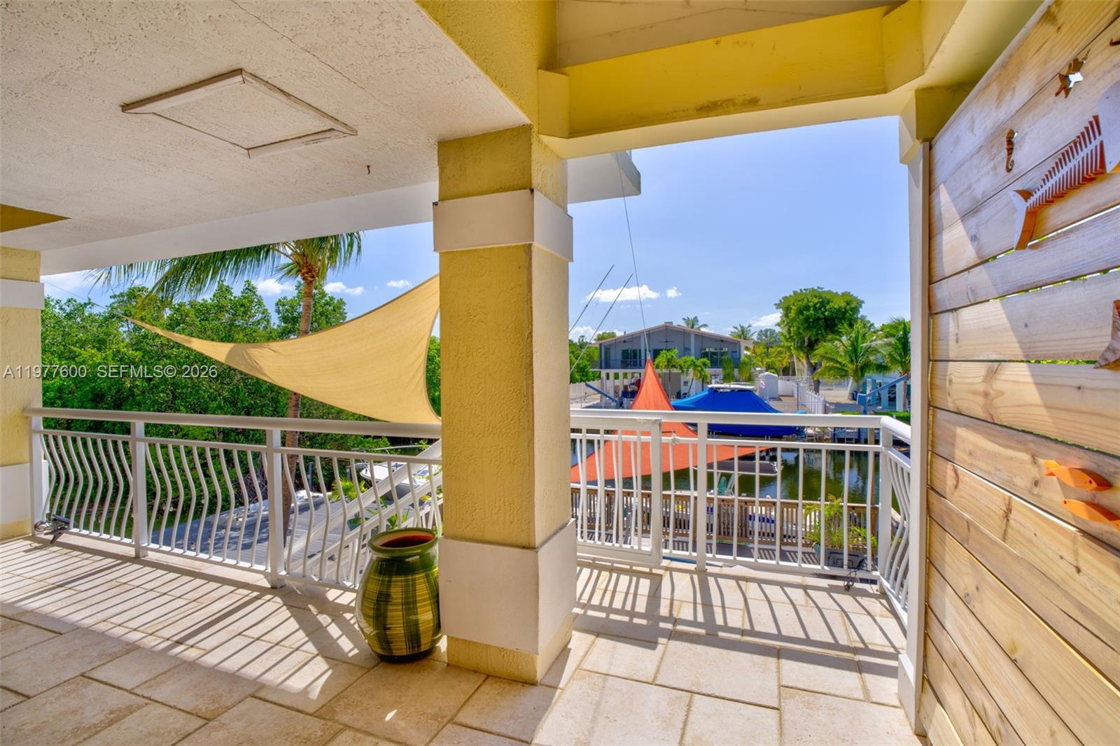 Spacious living room with panoramic views at 894 Ellen Dr - Luxury Home in Key Largo