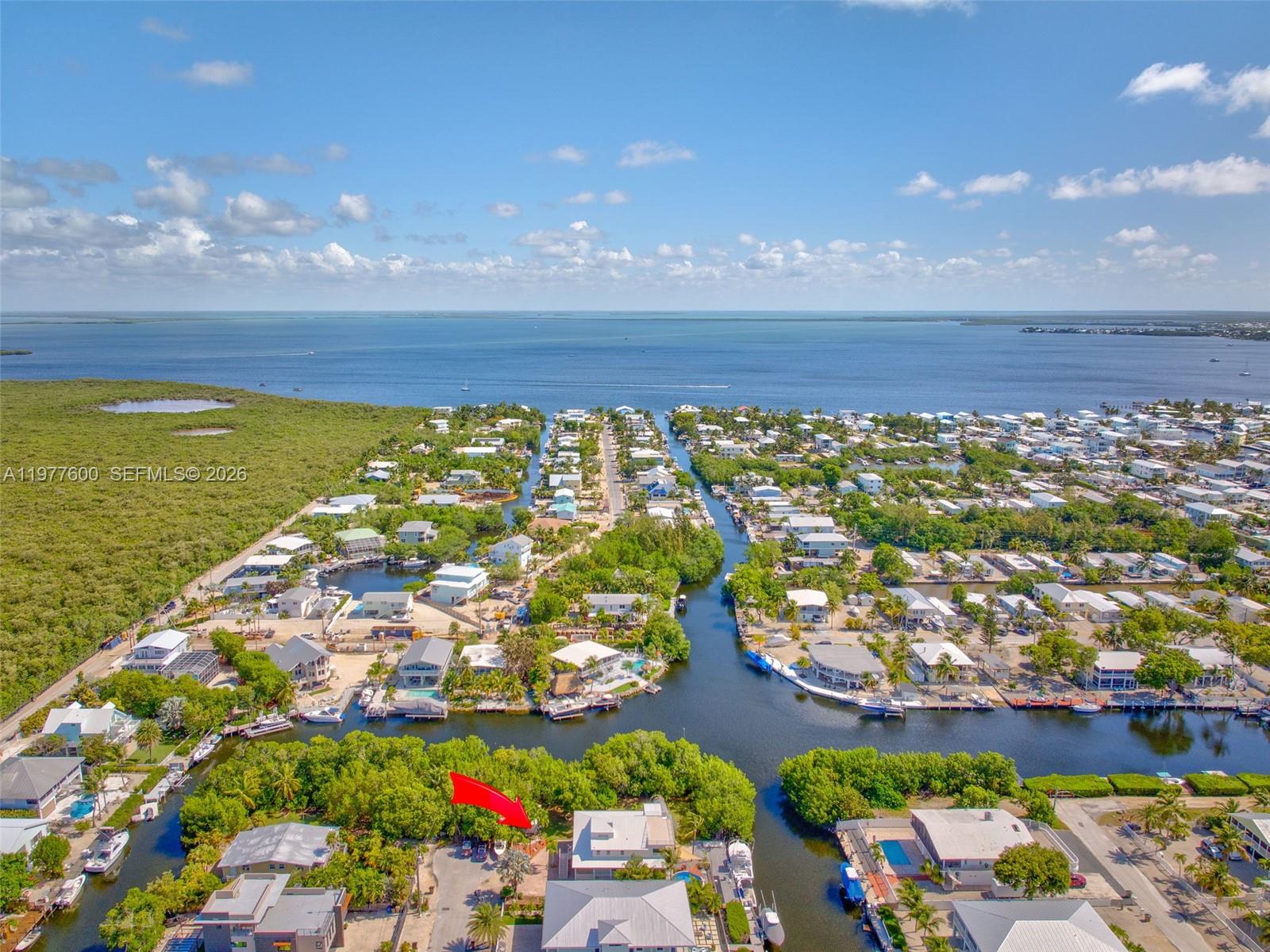 Spacious living room with panoramic views at 894 Ellen Dr - Luxury Home in Key Largo