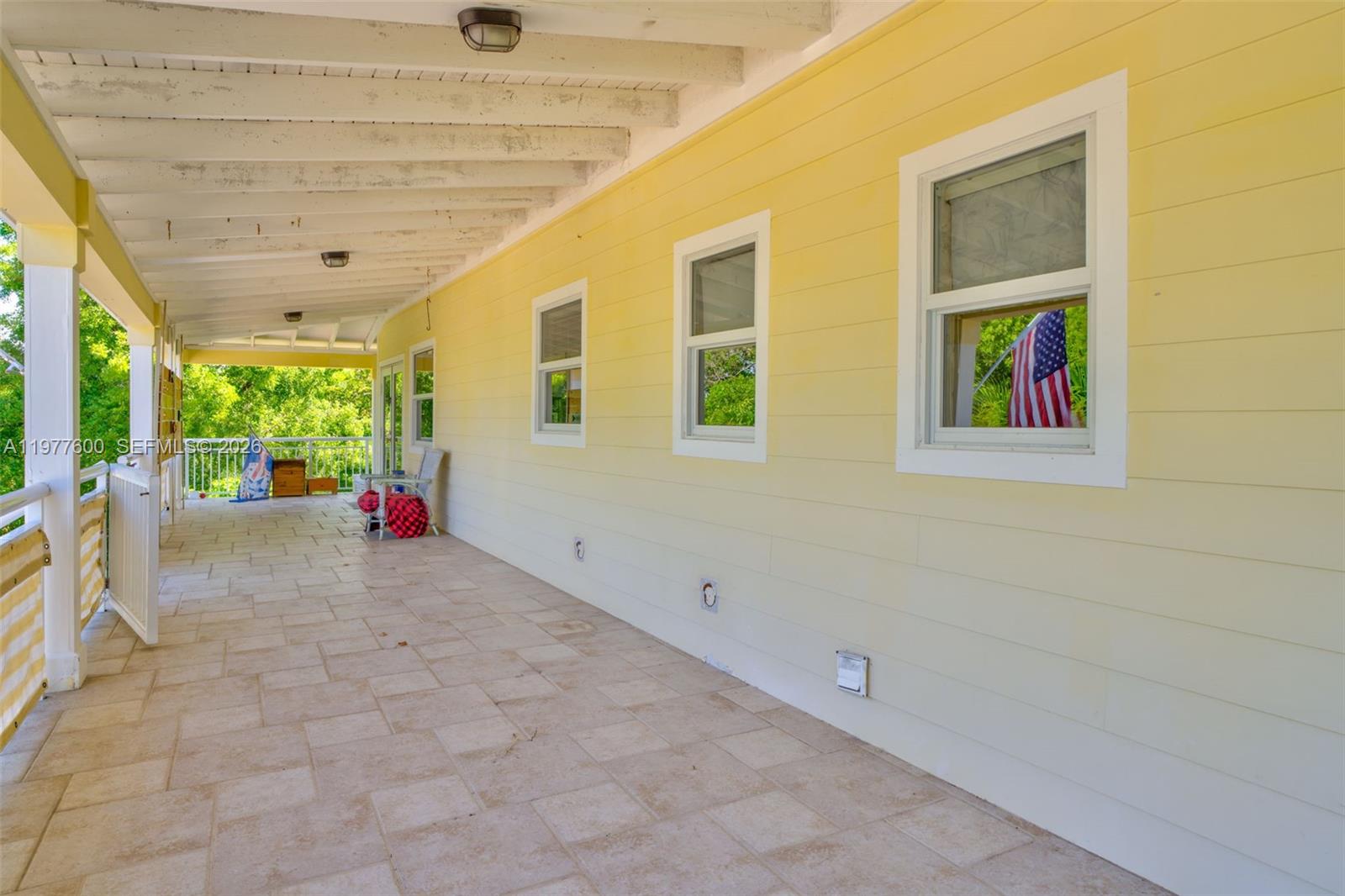 Spacious living room with panoramic views at 894 Ellen Dr - Luxury Home in Key Largo
