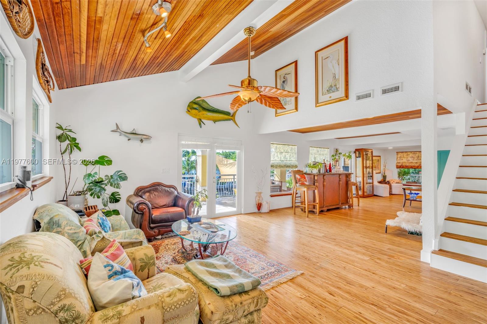 Spacious living room with panoramic views at 894 Ellen Dr - Luxury Home in Key Largo