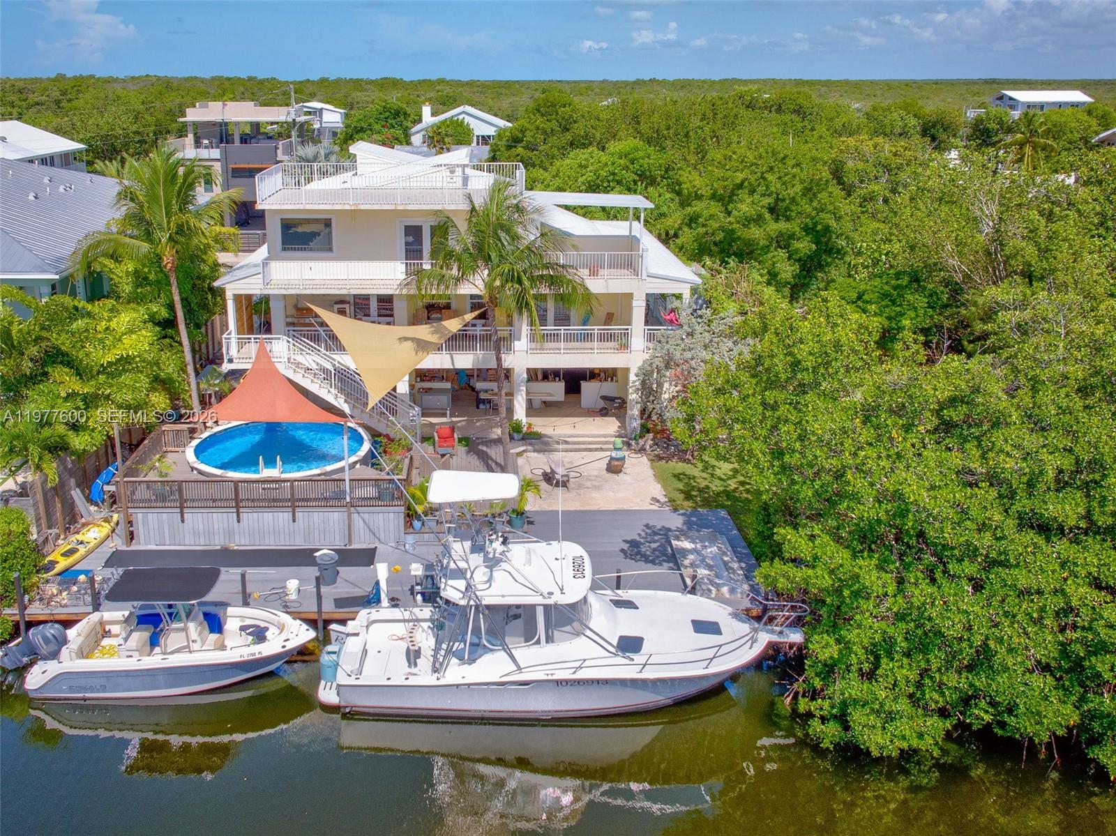 Well-appointed guest bedroom at 894 Ellen Dr - Luxury Home in Key Largo