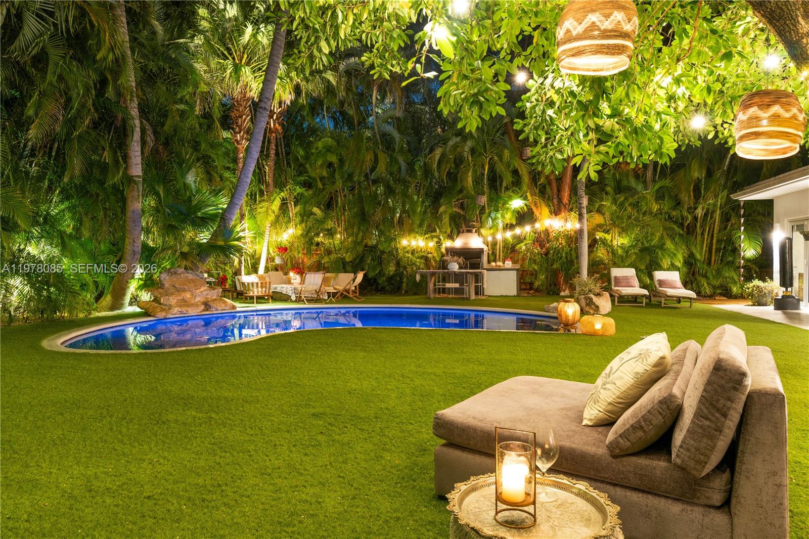 As per tax roll:Actual Area 3,312 Sq.FtLiving Area 3,202 Sq.FtAdjusted Area 2,911 Sq.FtLot Size 12,225 Sq.FtWelcome to Key Biscayne To a truly unique residence.Beautifully designed home blending Tulum-inspired warmth with Saint-Tropez elegance, ideally located within walking distance to the beach, restaurants, and coffee shops.Features include white concrete floors, high ceilings, and exposed white wood beams that create a bright and airy living environment. The reception/living area and Family room. Direct access to the garden and pool, providing seamless indoor-outdoor living.The main central point of the house is the oversized garden with Lush tropical plants and a Tiki Hut, that is an extension of the house....perfect for outdoor dining and entertaining.The home includes a family room, formal dining area, four en-suite bedrooms, PLUS  staff quarters (1/1) conveniently located adjacent to the kitchen. Private and secluded setting, with all main living areas oriented toward the garden and a beautiful mature tree that enhances the homes natural ambiance.