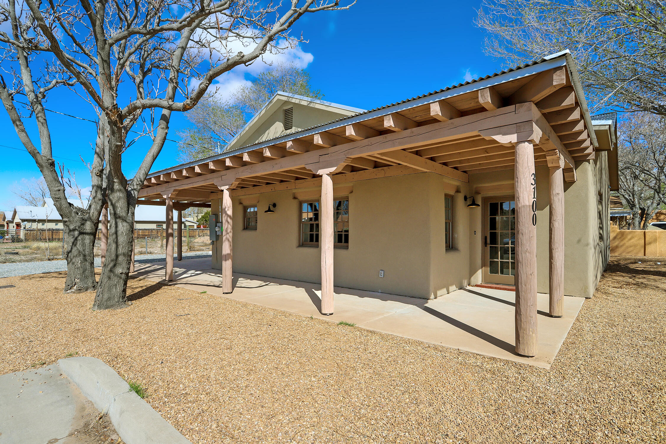 This elegant, newly constructed, all-adobe home sits down a quiet lane in Los Duranes, not far from the Rio Grande River. It's a jewel box that has room for everything, but not more than you need. With thick plastered adobe walls, beamed ceilings, a pitched galvanized metal roof, all-brick floors, and a wraparound portal, this home encapsulates New Mexican beauty; but is also brimming with modern conveniences including brand new water and sewer lines, gas meter, refrigerated air, a tankless water heater, quartz countertops, oak cabinets, double pane windows, drip system, synthetic stucco, and EV charger. On a cozy corner lot, it's perfect for lock and leave. Of the highest quality, and in a quiet charming neighborhood, now ready for the most discriminating buyer.
