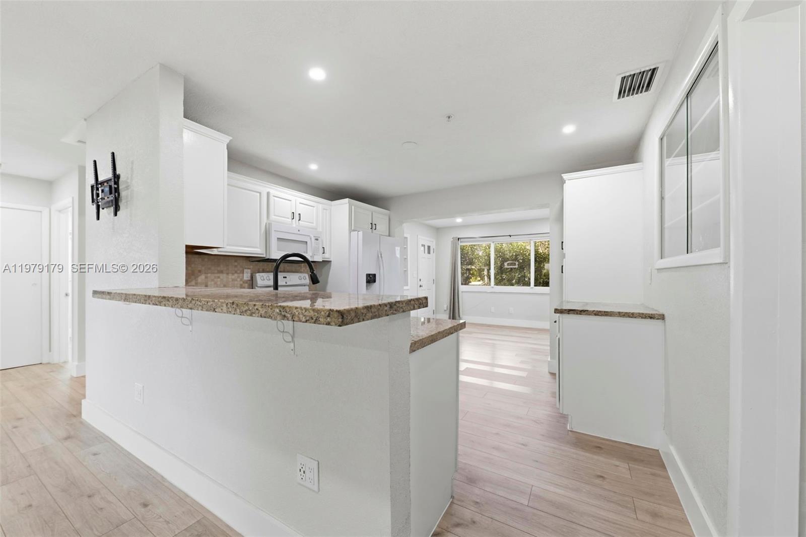 Well-appointed guest bedroom at 4561 25th Ter - Home in Dania Beach