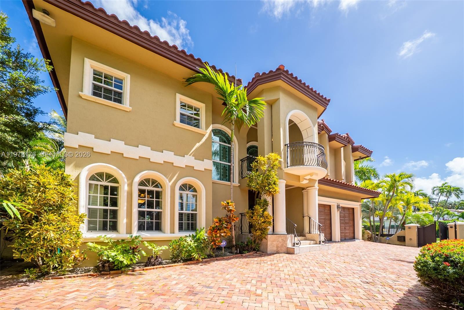 Premier location on N Bay Road- 5 bedrooms /4.5 bathroom corner lot, two story home built in 2003 using only the finest materials with efficiency and durability in mind. This residence features exceptionally high ceilings adorned with designer woodwork, generous living/dining areas, a spacious chef's kitchen w/ marble and solid wood floors. Enjoy the beautiful outdoors with 2 balconies, one offering Bay Views. Multiple-car garage with large doors & security system. Featuring total privacy, gated for extra security & on-site parking for up to six vehicles.  The storm-ready residence features impact glass and doors throughout, along with reinforced stone sills surrounding all windows. The home's structure is double-insulated for soundproofing and exceptional energy efficiency, and its high base elevation protects against flooding. Walking distance to places of worship, La Gorce Country Club, and the beaches. Close proximity to Mt. Sinai, with quick & easy access to major expressway's.