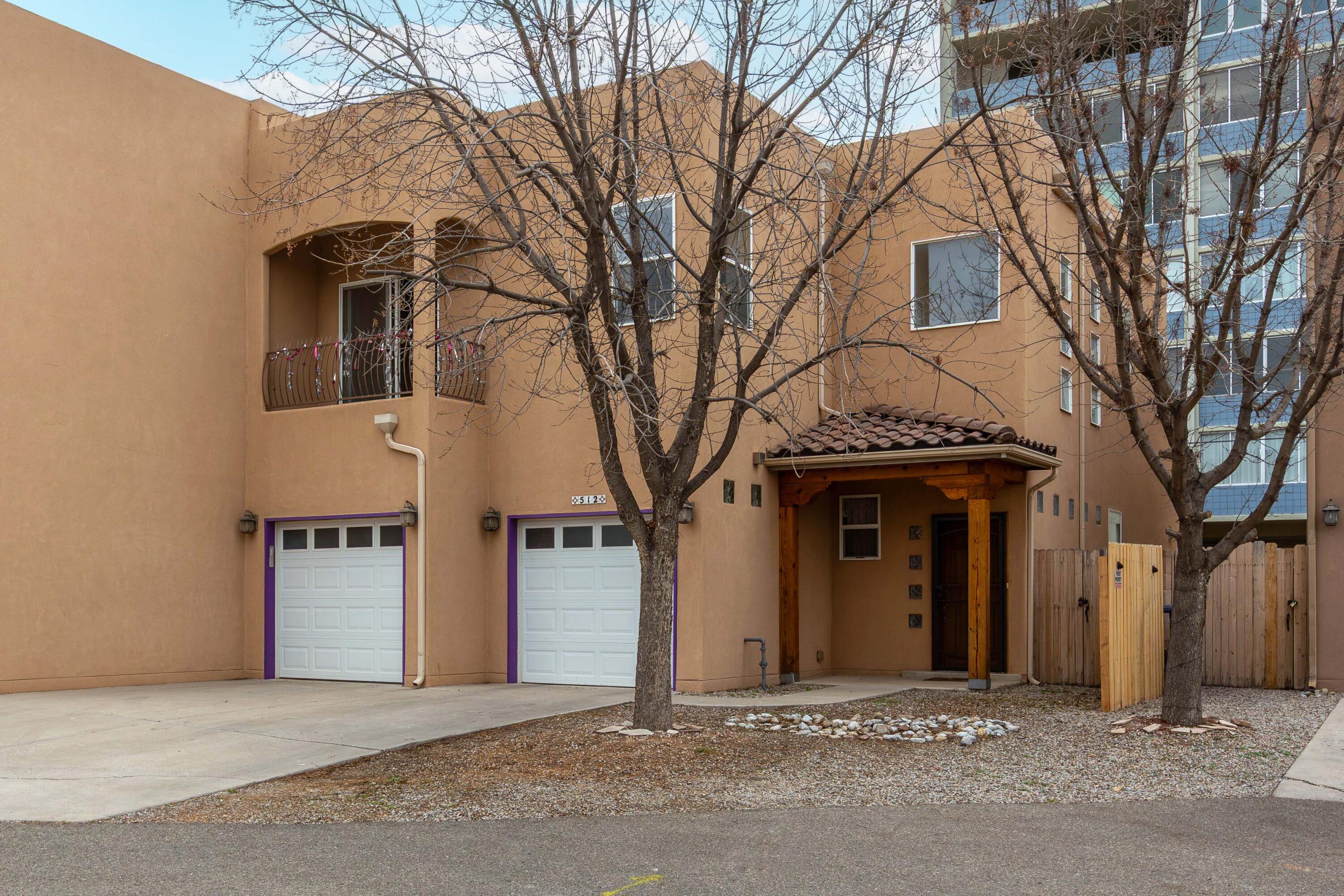 Built in 2008, this roomy two-story townhome sits just a couple of blocks from Rio Grande Park and Tingley Beach, with quick access to the zoo and everything Downtown and Old Town have to offer--restaurants and shopping are all close by. A TPO roof replaced in 2019 adds peace of mind right from the start. Inside, you'll find engineered wood flooring on the main level, soaring ceilings with clerestory windows that bring in great natural light, and refrigerated air to keep things cool when temperatures climb. Energy-efficient windows further enhance comfort and efficiency. Upstairs, the spacious primary suite opens to one of two balconies Parking is easy with a two-car garage plus driveway space for two additional vehicles. Schedule a showing today!