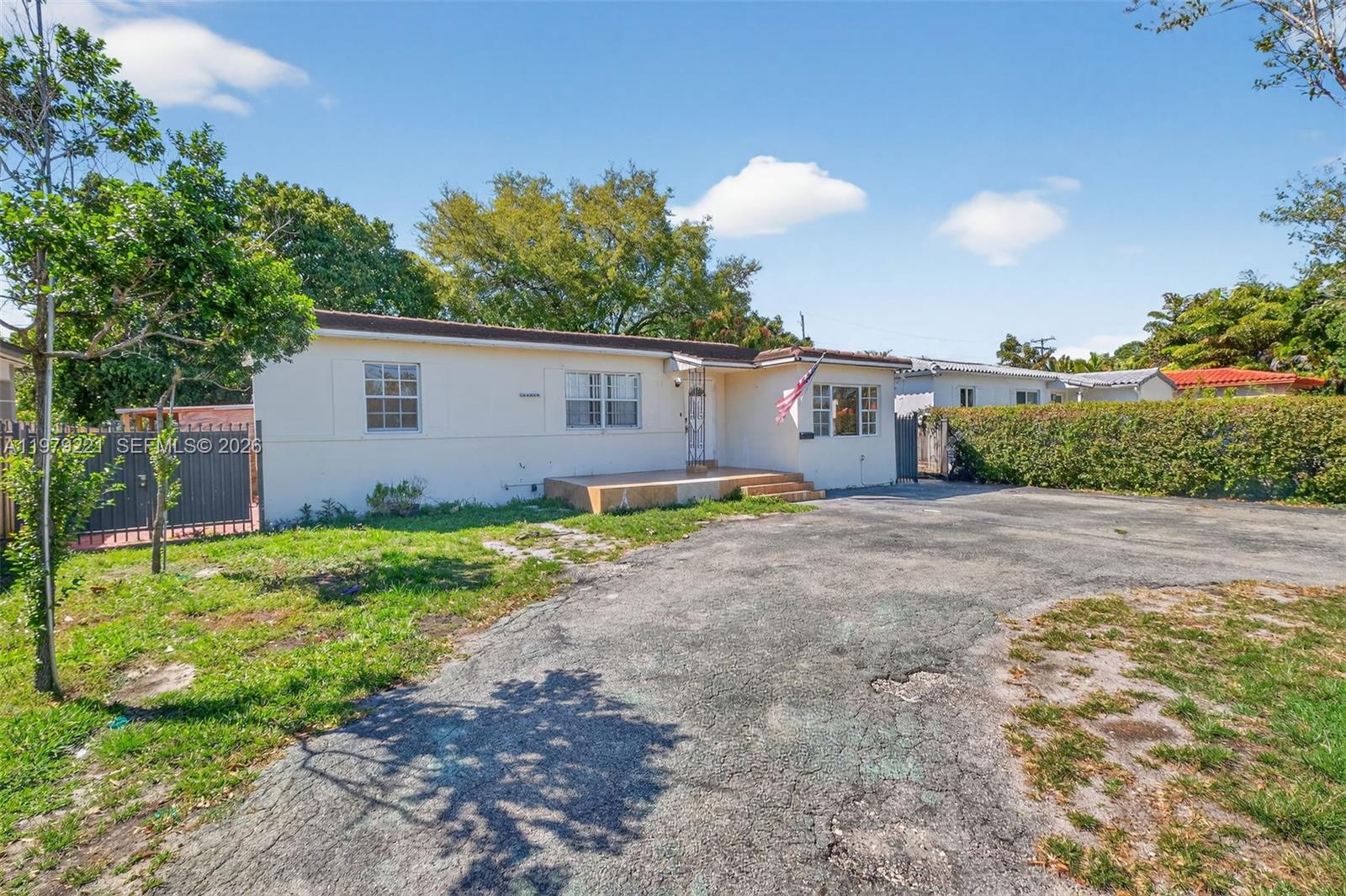 Versatile property with rare income-producing potential and fully permitted upgrades. This unique home features a detached, fully permitted ADU, ideal for rental income, a guest house, or a private mother-in-law suite. The main home features three private entrances, allowing flexible use as separate spaces or the option to easily restore a larger single-family layout, creating strong rental potential. The laundry room has been converted into a private studio, creating additional space for guests or income potential. A 2019 barrel tile roof provides added peace of mind for the new owner. Situated on a fully fenced lot in a highly central location, this property offers both immediate versatility and long-term redevelopment potential. Whether you're looking for income-producing potential, multi-generational living, or future investment upside, this property presents a rare opportunity with multiple paths for homeowners and investors alike.