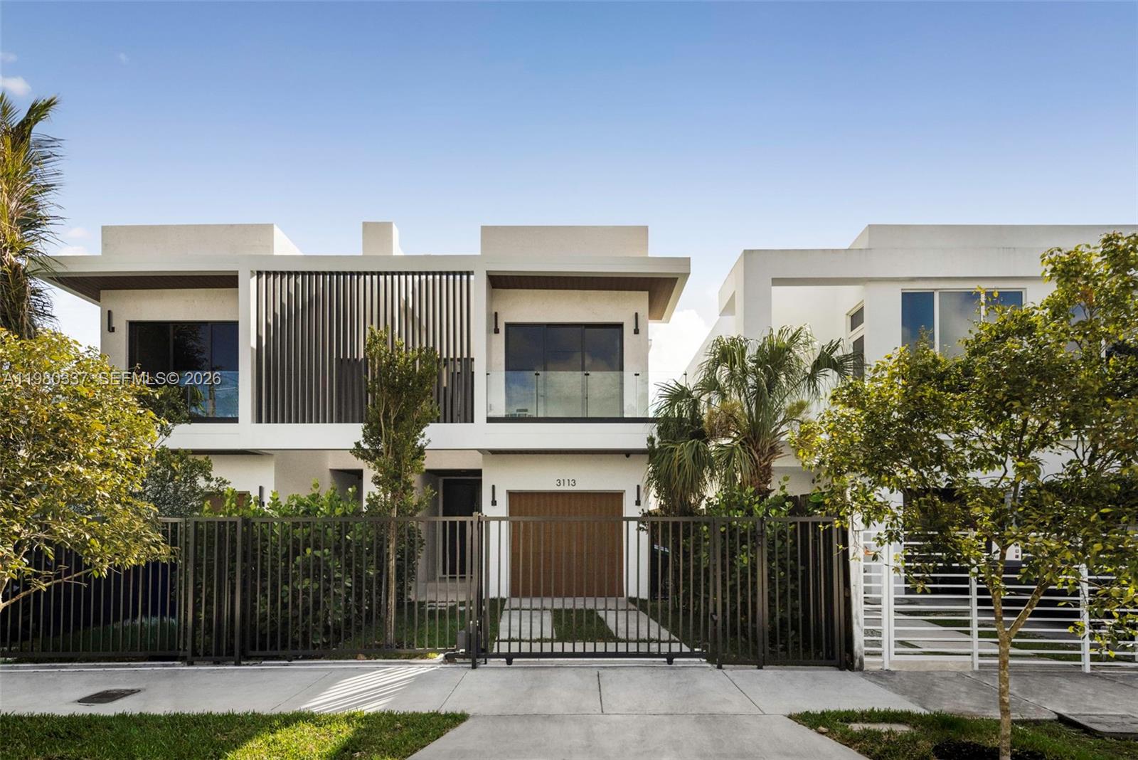 Exceptional new construction townhouse offering nearly 3,000 SF of refined living in the heart of Coconut Grove. Thoughtfully designed for modern indoor-outdoor living, this 4-bedroom, 3.5-bath residence features soaring 10-ft ceilings, floor-to-ceiling impact glass, and a seamless open layout filled with natural light. High-end finishes include custom Italian cabinetry, large-format porcelain flooring on the main level, and wood floors upstairs. The chef’s kitchen flows effortlessly into spacious living and dining areas, ideal for both everyday living and entertaining.Step outside to a private backyard retreat complete with pool and summer kitchen, or enjoy sunset gatherings on the expansive rooftop terrace. Smart home technology and integrated systems throughout elevate comfort and convenience. Ideally located just moments from CocoWalk, parks, and marinas, and within the Coconut Grove Elementary school district, this residence offers the best of Grove living with exceptional design, quality, and location.