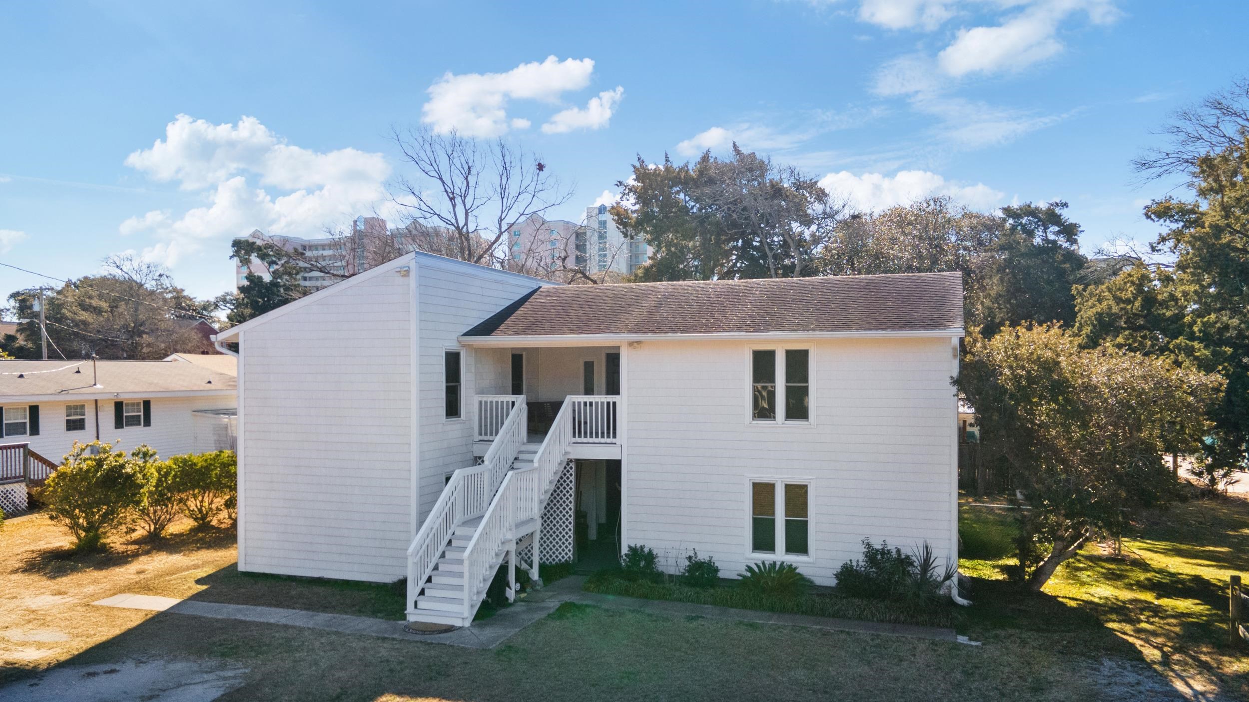 What an opportunity so close the beach!! Two units, both identical layouts, featuring 3 bedrooms and 2 baths. Units are one upstairs, and one downstairs.  Large deck off the top floor unit that would be perfect for family gatherings.