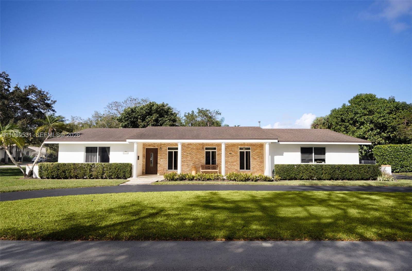Set on an oversized corner lot in Palmetto Bay, this one-story pool home offers exceptional space and long-term potential. A spacious circular driveway leads to the covered side garage and welcoming front terrace. Inside, expansive living and dining areas create an inviting setting for entertaining and everyday living, complemented by a separate family room with direct access to the pool and backyard. The kitchen connects easily to the outdoor area, enhancing indoor-outdoor flow, while the primary suite features its own bath and private access to the pool. Impact windows and updated PVC plumbing add peace of mind. The oversized backyard and extra-large side yard offer remarkable flexibility for outdoor living, recreation, or future expansion, with room for a summer kitchen, sports court, garden, or additional amenities. Mature mango and avocado trees add charm to the landscape. Located just blocks from Coral Reef Park and close to Deering Estate, top private schools, and US-1 for convenient access throughout Miami-Dade.