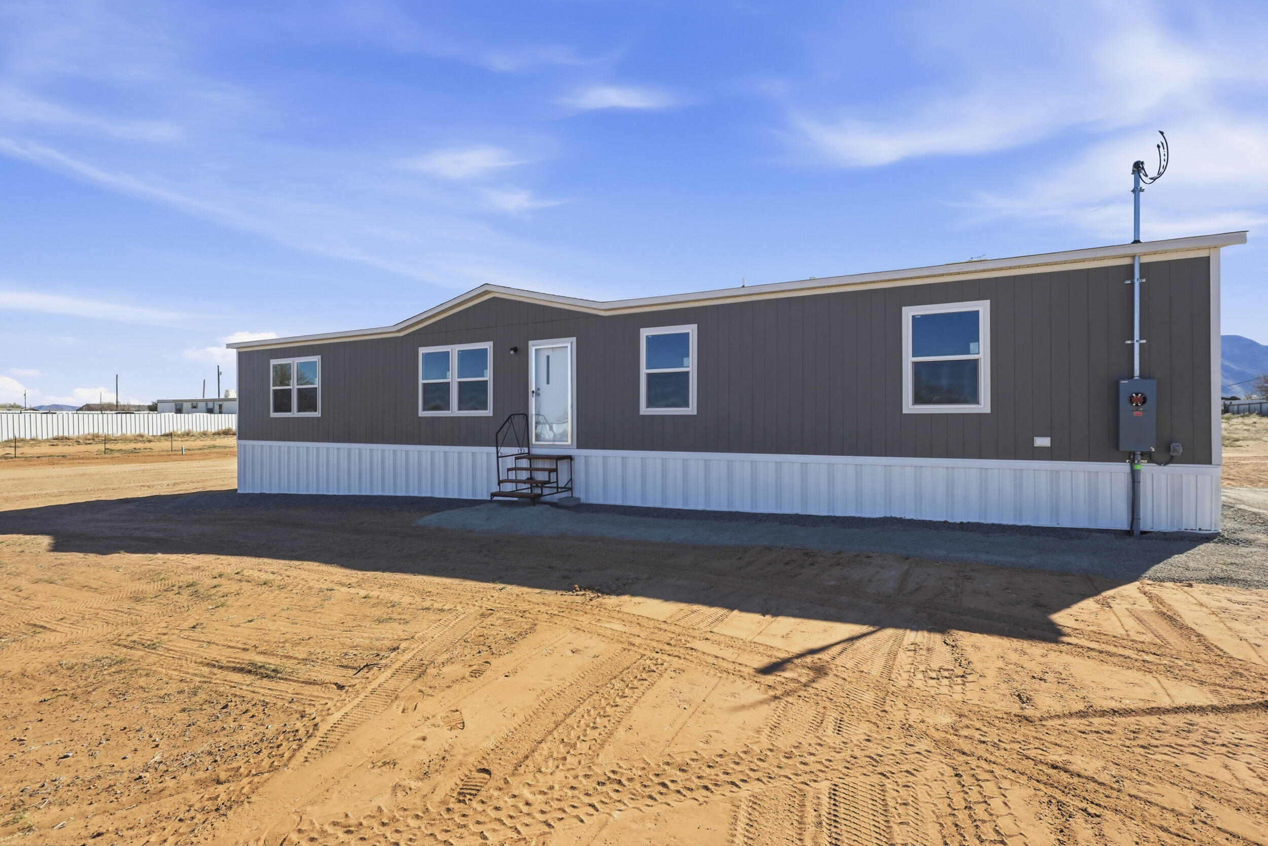 Grant now available in Valencia County offering first time buyers $30,000 PLUS this seller willing to provide an additional $10,000 in buyer closing costs!!**Discover this stunning brand new 4-bedroom, 2-bath home set on a spacious one-acre lot with breathtaking mountain views. Enjoy comfort year-round with refrigerated air and a fully fenced yard for privacy. The split primary suite features walk-in closets and a luxurious bathroom with a separate shower and garden tub. Entertain in two spacious living areas, cook in a modern kitchen with island, and benefit from a convenient service room. Your dream home awaits!