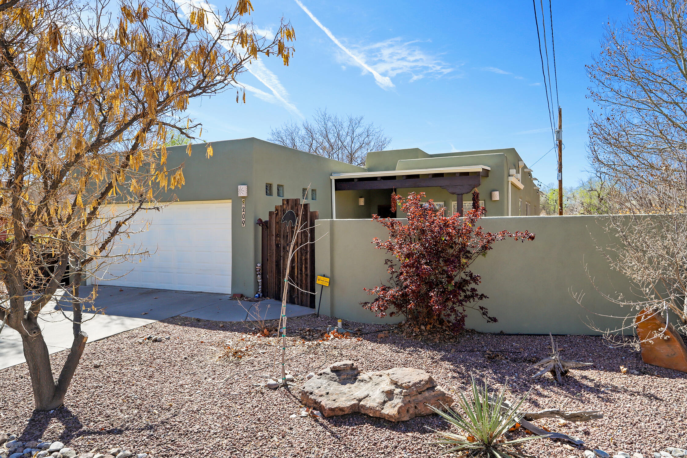 Single-level home located in the coveted gated community of The Gardens on the Rio Grande, offering 1,842 sq ft. This thoughtfully designed residence features 3 bedrooms plus a 9' x 10' home office conveniently located just off the front entry-perfect for working from home or a quiet study space.The spacious floorplan includes a generous living room, formal dining area, and a well-appointed kitchen with granite countertops, gas range, microwave (2024), and dishwasher (2025). Tile flooring that beautifully resembles wood runs throughout most of the home, while the office features laminate flooring. Both bathrooms have been recently remodeled. The primary bath showcases vessel sinks, granite counters, and a relaxing jetted tub, creating a spa-like retreat. Comfort is enhanced by radiant