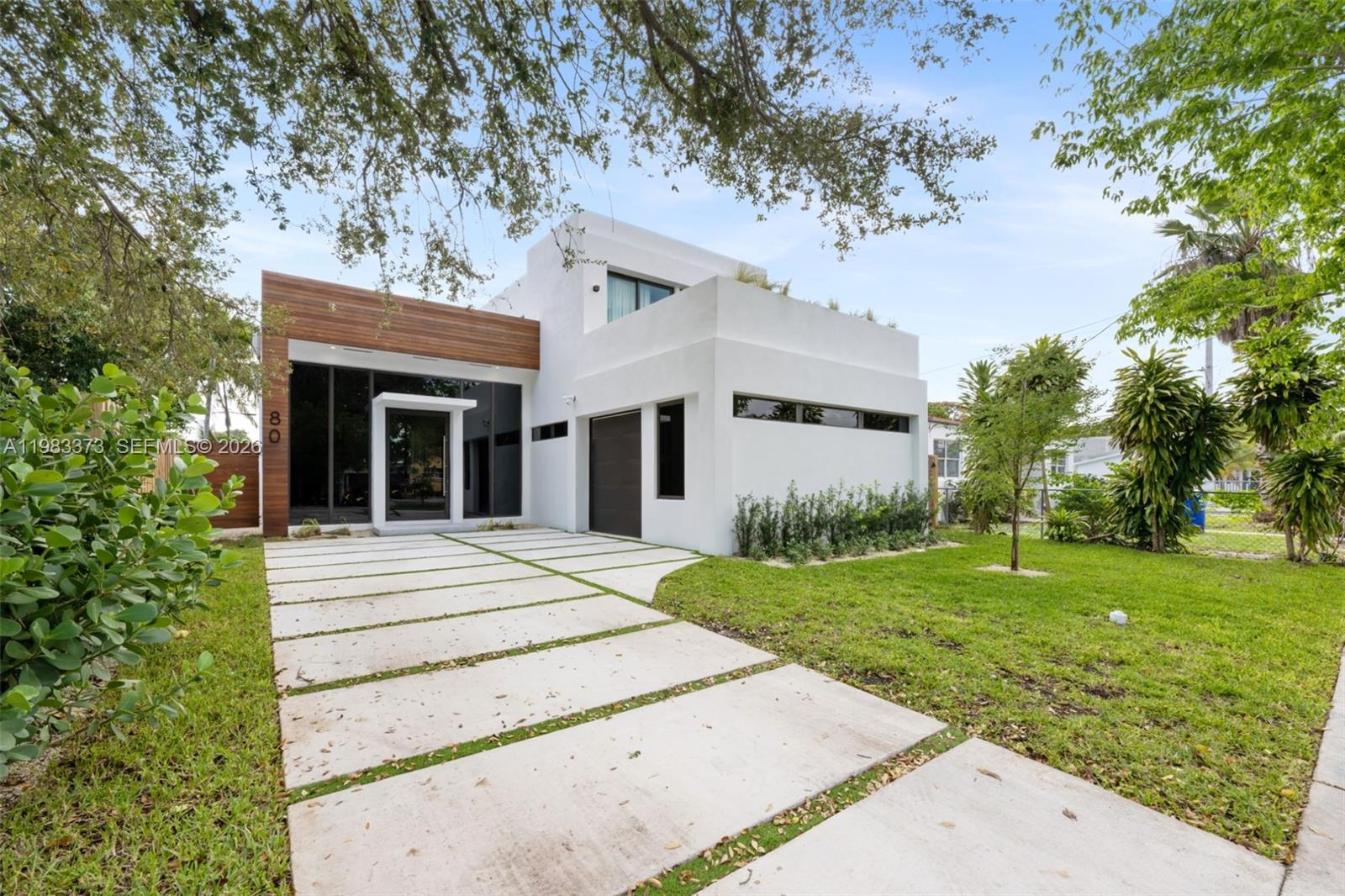 Located just a few blocks from the Miami Design District, this stunning residence offers 3,642 total SQ/FT of refined living space with soaring 13’ ceilings, elevated finishes, a sleek black accent chef’s kitchen, and an additional 2 bed 1 bath build out. Designed for effortless indoor outdoor living, floor to ceiling windows fill the home with natural light throughout. The backyard is perfect for entertaining, featuring a pool, patio, and dedicated BBQ area. Set in a prime location near Miami’s best shopping and dining, and just 10 minutes from Miami Beach, this home captures the modern luxury and vibrant lifestyle of the surrounding new developments. Schedule your private showing today.
