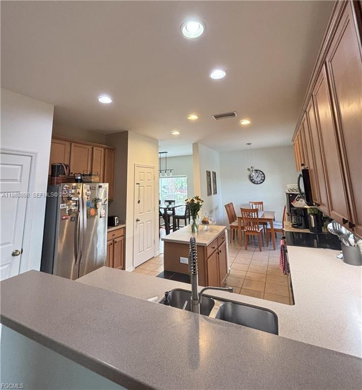 Open-concept living area at 8042 Silver Birch Way - Home in Lehigh Acres