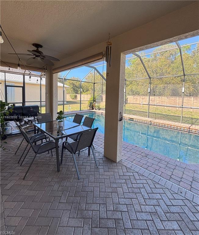 Open-concept living area at 8042 Silver Birch Way - Home in Lehigh Acres