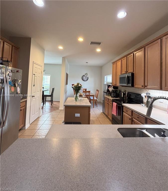 Spacious garage and storage at 8042 Silver Birch Way - Home in Lehigh Acres
