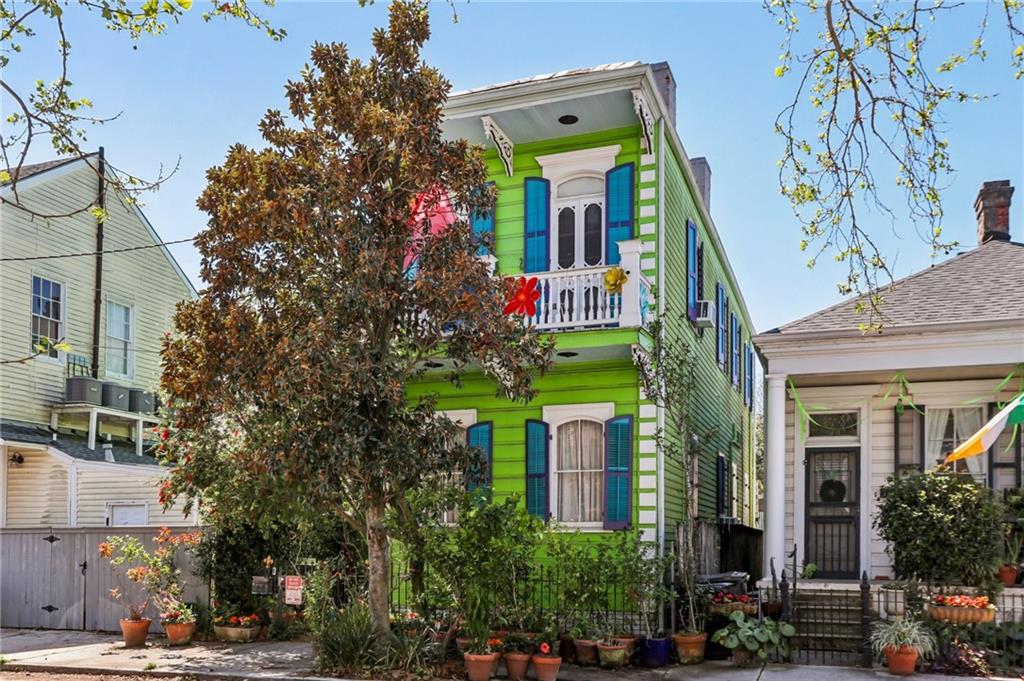 Tucked behind a lush secret garden entrance, this distinctive Irish Channel home blends classic New Orleans architecture with artistic flair. Inside you’ll find wood floors, tall ceilings, and exposed brick fireplaces that add warmth and character throughout. Thoughtfully designed built-in bookshelves create both charm and function, perfect for displaying books and art. Approximately 1700 square feet with first floor featuring living & dining rooms, powder room, office and kitchen. Upstairs includes 3 bedrooms and 1 full bath. Located in the heart of the Irish Channel, one of New Orleans’ most beloved historic neighborhoods, this home is just a block from the energy of Magazine Street’s restaurants, cafés, galleries, and boutiques. Enjoy a walkable lifestyle while living in a neighborhood known for its colorful history, vibrant architecture, and strong sense of community.