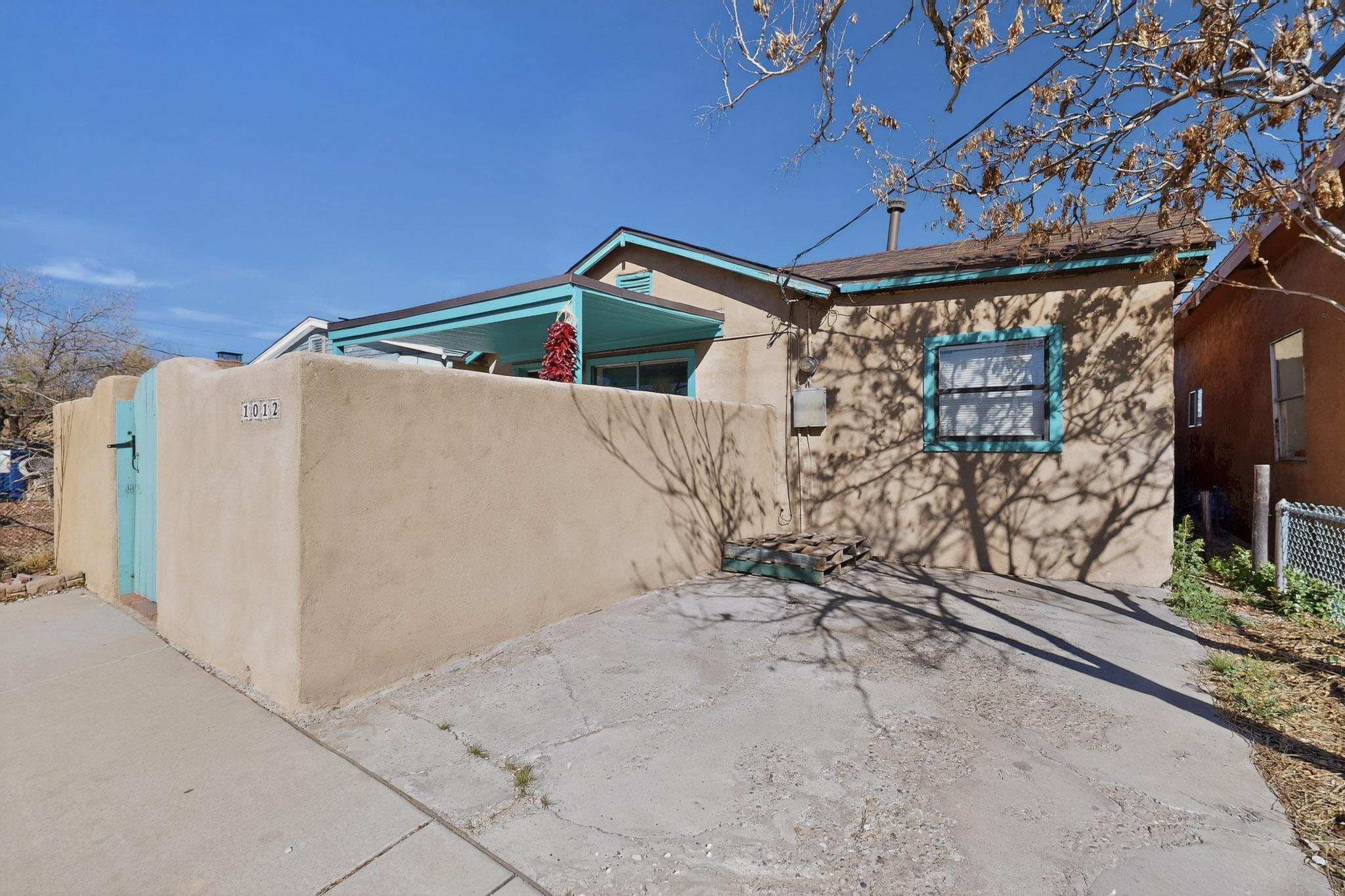Location, Location, Location! Welcome to 1012 21st Street--an enchanting 2-bedroom, 1-bath adobe casita nestled in the heart of the desirable Sawmill District. This warm and inviting home or potential investment opportunity, offers the perfect blend of classic New Mexico charm and exciting potential to make it your own.Step inside to find much of the home's original character thoughtfully preserved, with room to elevate and personalize--ideal for a first-time homeowner, artist at heart, or anyone seeking a true Southwest retreat. The kitchen and bathroom feature timeless Saltillo tile, adding authentic texture and warmth, while outside you'll love the beautifully paved patio--perfect for morning coffee, evening entertaining, or relaxing under the New Mexico sky.