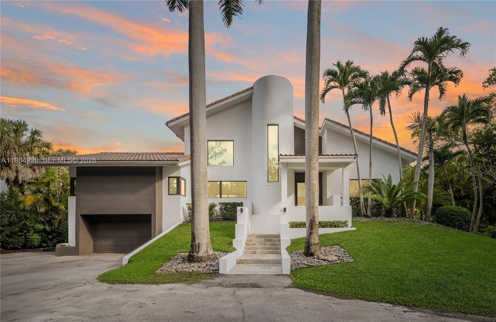 Experience a residence of true presence in this fully remodeled lakefront estate, perfectly situated within the prestigious guard-gated community of Gables/Pinecrest by the Sea. This home radiates modern style and meticulous cleanliness, centered on a new chef's kitchen and a primary suite of incredible magnitude and privacy. From the moment you enter, the abundant natural light and soaring ceilings create an atmosphere of positive energy and sophistication. The layout is designed for the modern lifestyle, featuring an executive office, a beautiful private courtyard for intimate gatherings, and spacious bedrooms with ample closet space and amazing storage throughout. Outside an entertainer's dream, the property offers a sanctuary of mature landscaping and a large pool with Carrera marble deck overlooking the lake, all secured by a dual-gate system for ultimate peace of mind. The expansive, smooth driveway provides rare and generous space for cars, boats, or an RV. Located just moments from the Arnold Palmer-designed golf course, the newly renovated Chapman Field, and the exclusive Deering Bay Club, this home offers unparalleled access to South Florida’s finest recreation. Whether you are enjoying the serene lake views or the luxurious interior finishes, this property stands as a masterclass in elegance.