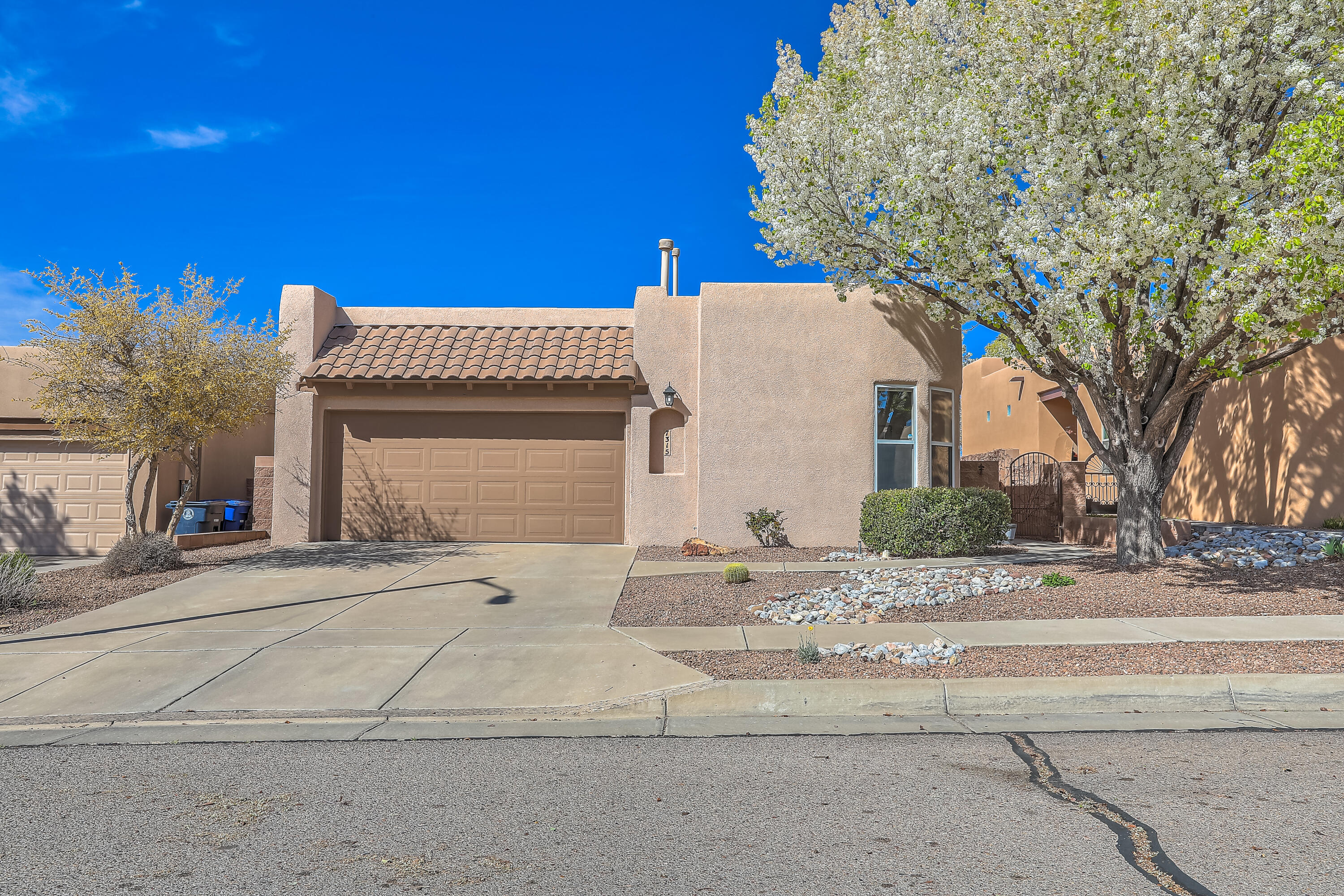 Beautiful single story home in desirable La Cueva School district. Built by Scott Patrick, with his signature large picture windows, elevated tray ceilings, many skylights, and bright open floor plan. Kitchen boasts newer high end stainless steel appliances and lots of cabinets. Primary bedroom is spacious, and bathroom has separate shower and garden tub. Additional three bedrooms are all generous sized. The thoughtfully landscaped  backyard has a large covered patio, dedicated dog run, raised garden beds and backs to the park. No rear neighbors just views of the mountains. This home has been very well maintained.